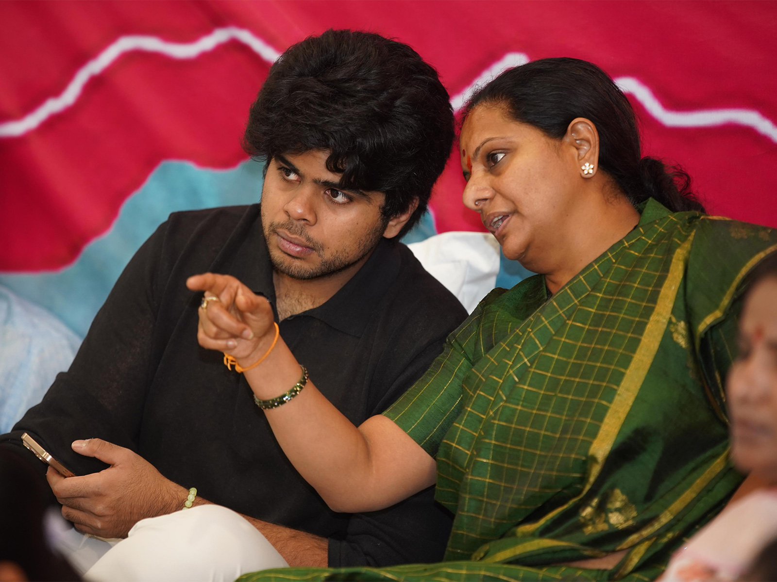 Telangana Jagruthi President K Kavitha with son Aditya (Photo/ANI)