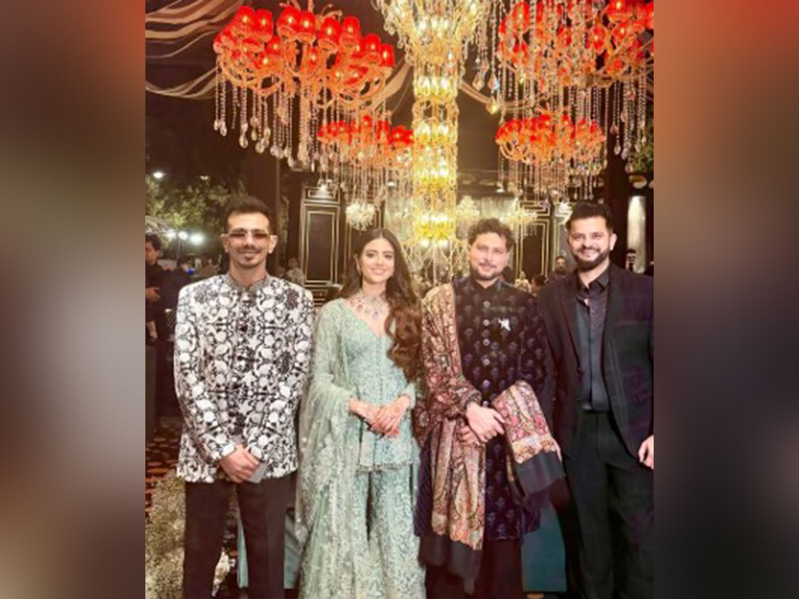 Kuldeep Yadav and his fiance Vanshika posing with Suresh Raina and Chahal (Image source: Suresh Raina's Instagram handle) Kuldeep Yadav and his fiance Vanshika posing with Suresh Raina and Chahal (Image source: Suresh Raina's Instagram handle)