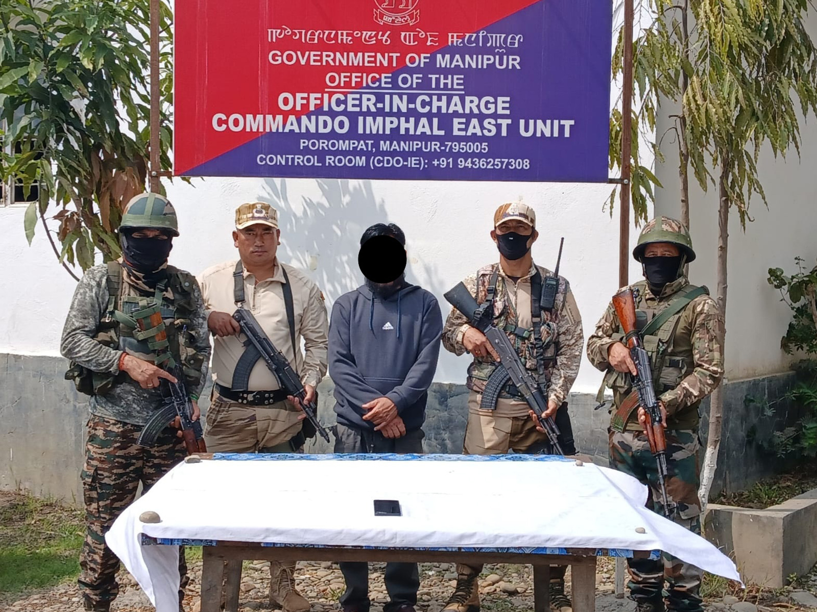 Manipur Police with the arrestee (Photo/ANI)