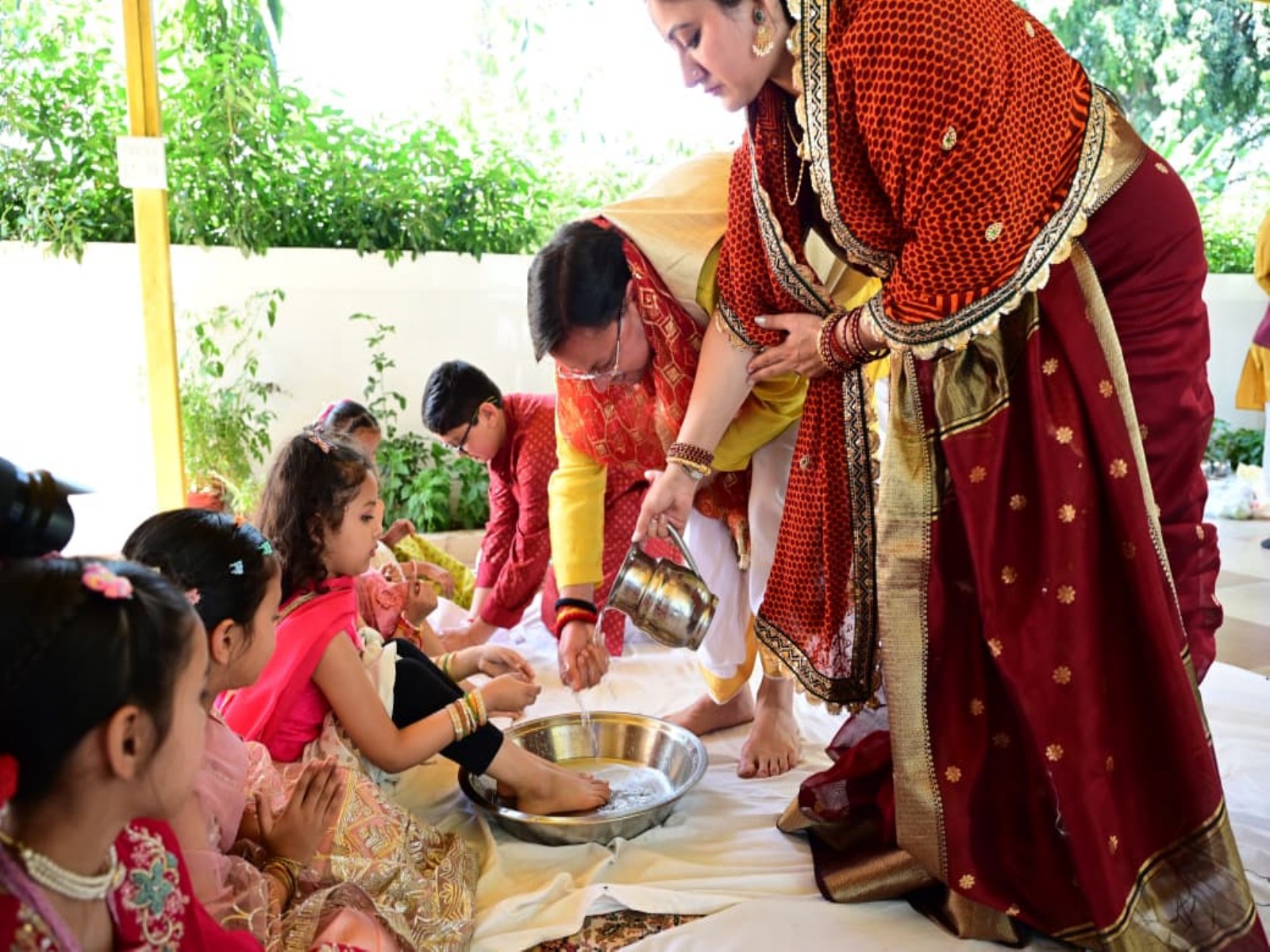 Uttarakhand CM Pushkar Singh Dhami performs Kanya Pujan along with wife (Photo/ANI) Uttarakhand CM Pushkar Singh Dhami performs Kanya Pujan along with wife (Photo/ANI)