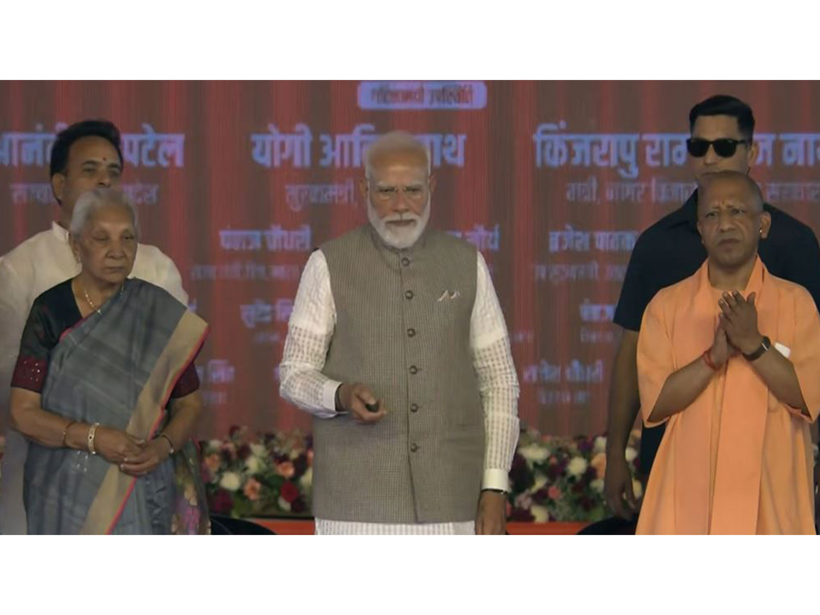 Prime Minister Narendra Modi with UP Governor Anandiben Patel and CM Yogi Adityanath (Photo/DD) Prime Minister Narendra Modi with UP Governor Anandiben Patel and CM Yogi Adityanath (Photo/DD)