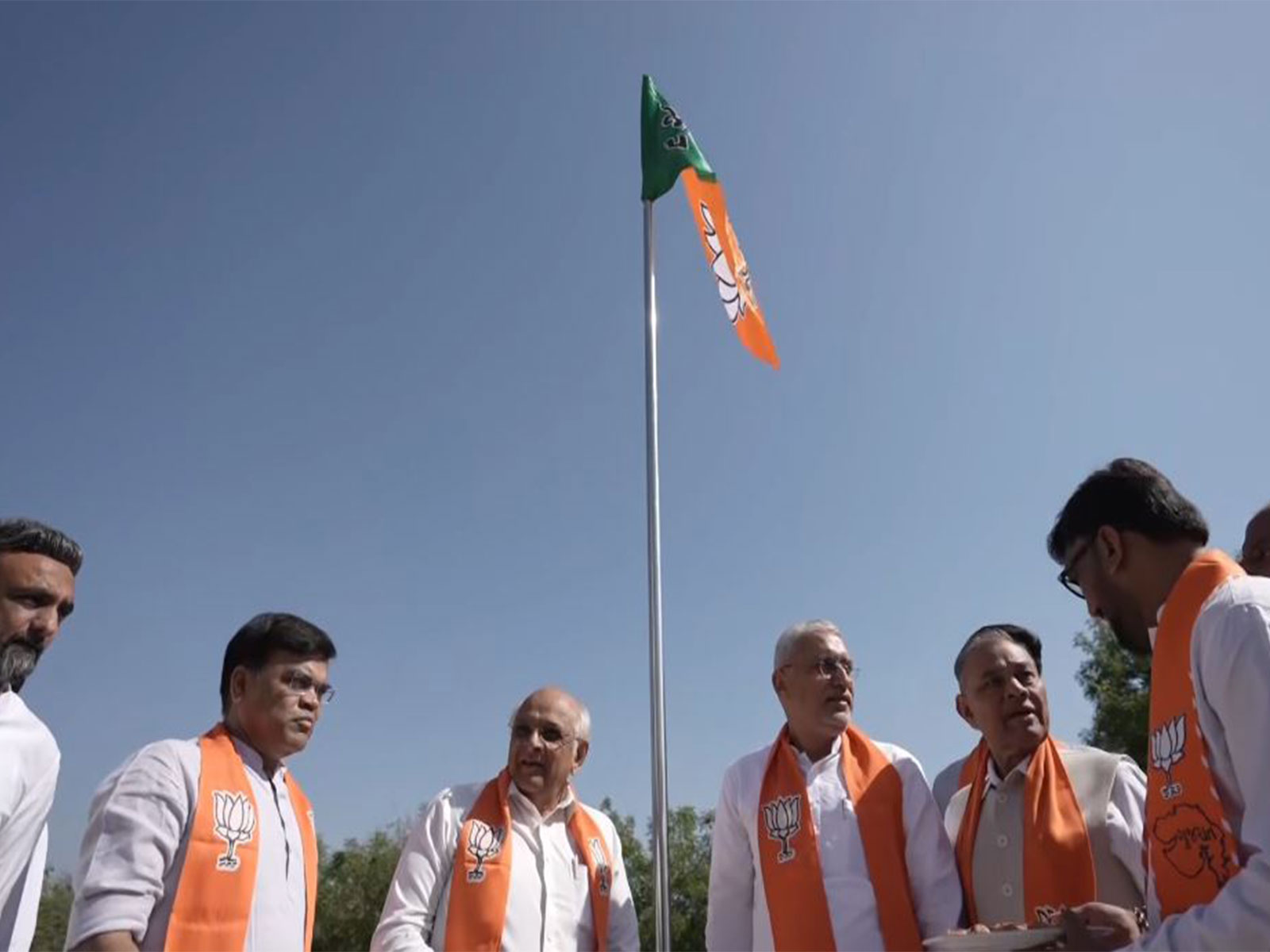 Gujarat CM Bhupendra Patel, BJP leaders hoist party flag in Gandhinagar (Photo/ANI)