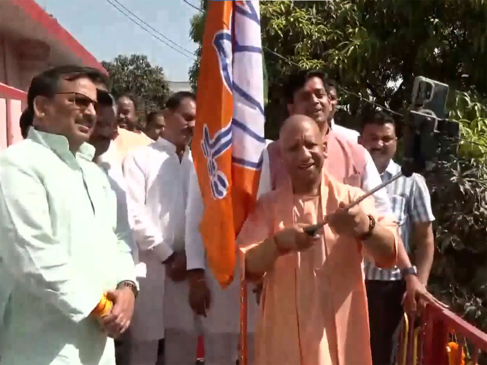 UP CM Yogi Adityanath hoists BJP flag at Gorakhnath temple (Photo/ANI)
