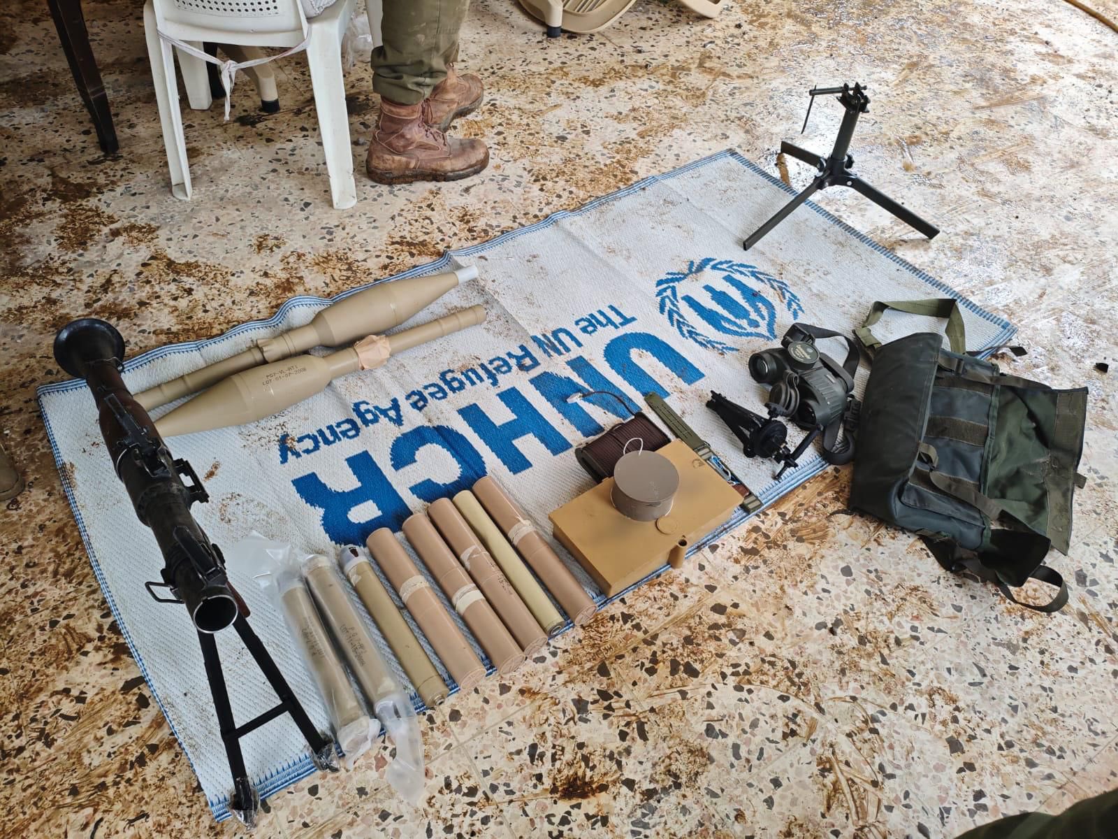 IDF discovers weapons, underground quarters in Southern Lebanon alongside a flag of UNHCR (Photo/X/@IDF)