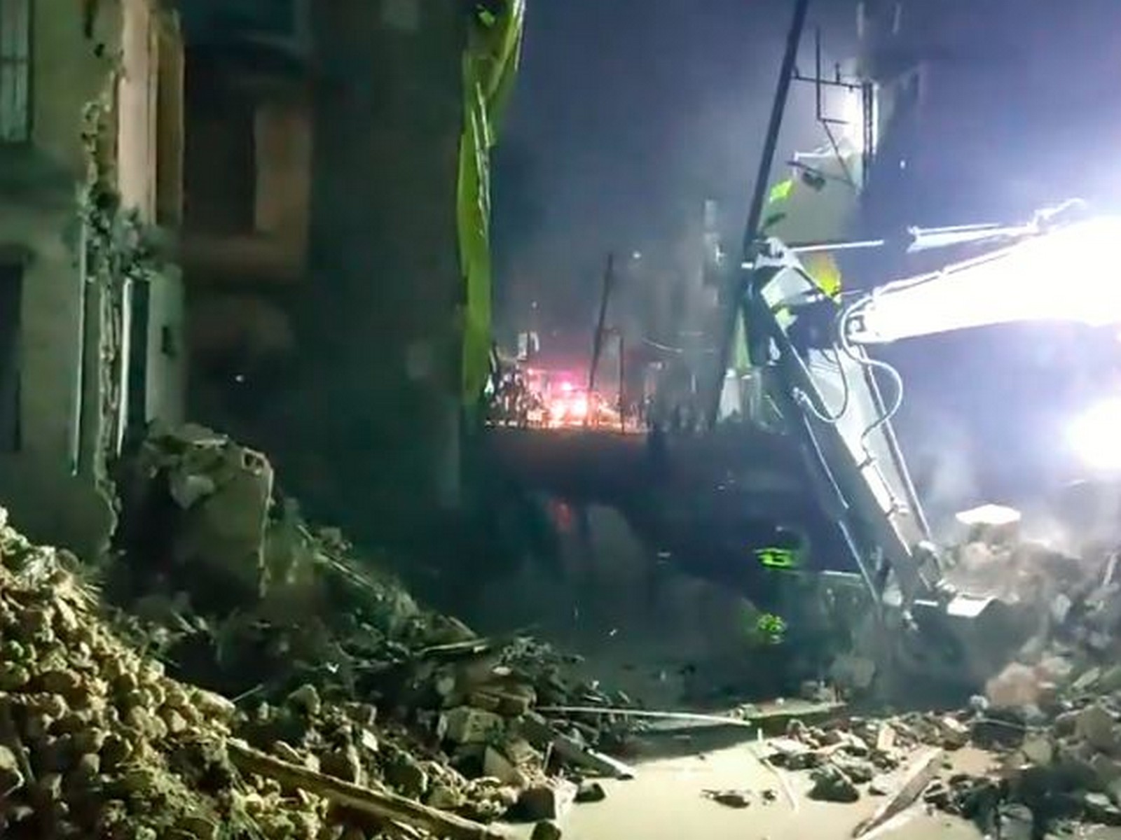 A three-storey building collapses near Gebi Hanuman Temple in Ujjain on Monday evening. (Photo/ANI)