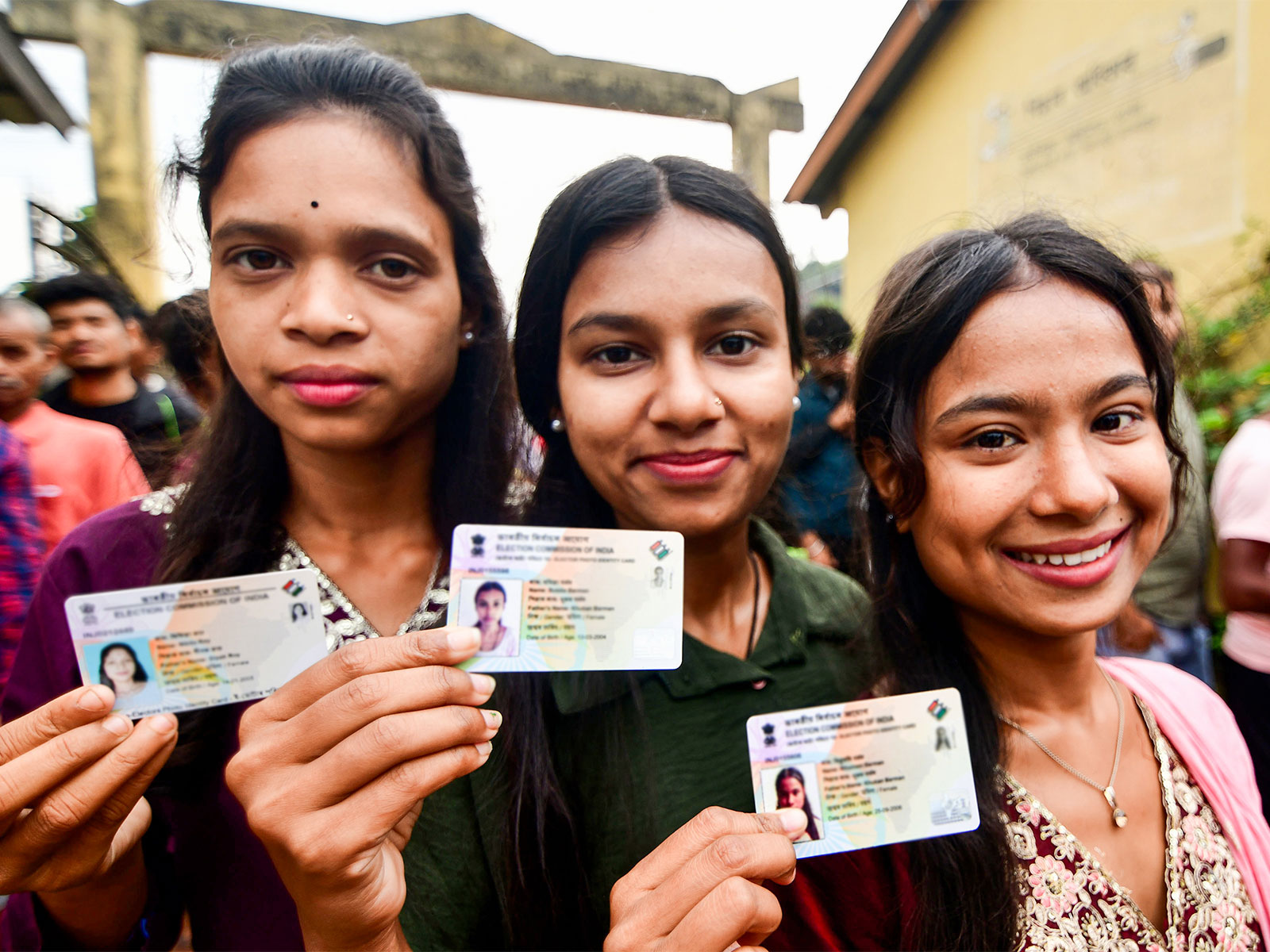 Voters show their voter IDs as they cast their votes (File Photo/ANI)
