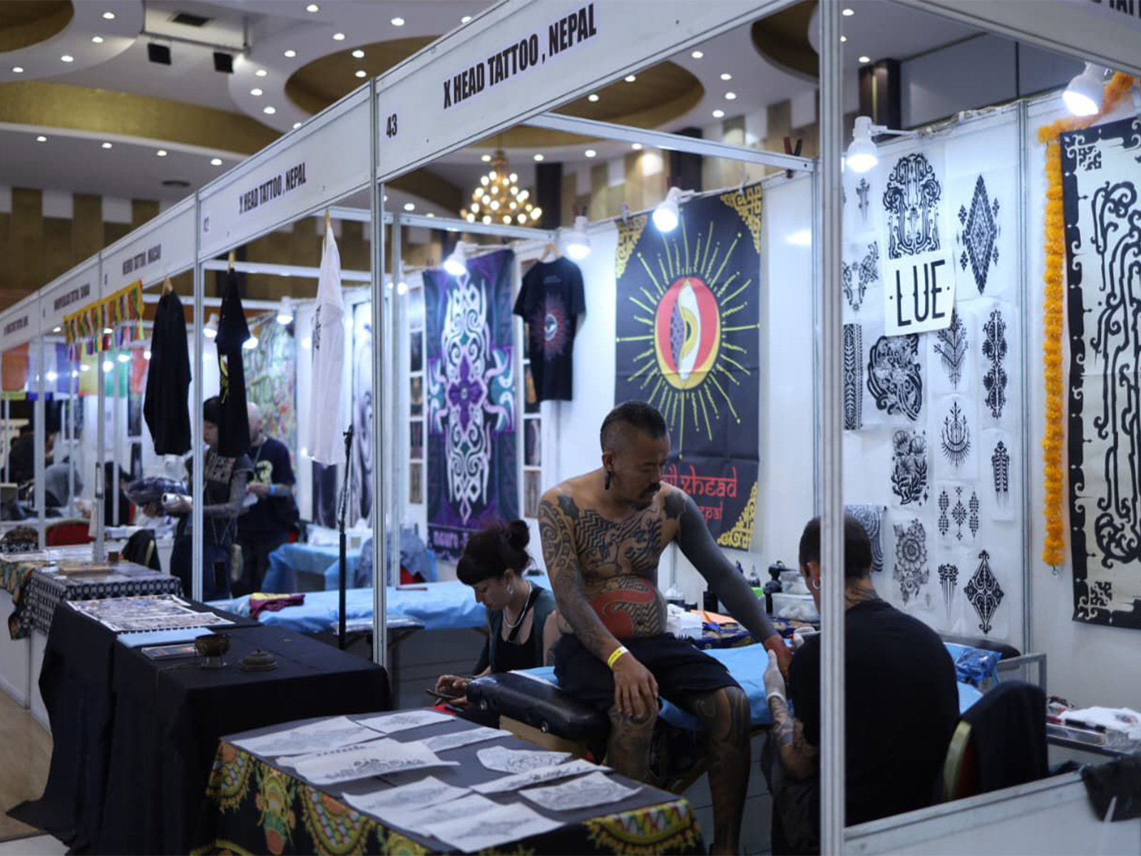 Tattoo artists at work during the International Nepal Tattoo Convention in Lalitpur, showcasing intricate designs and global styles. (Photo/ANI)