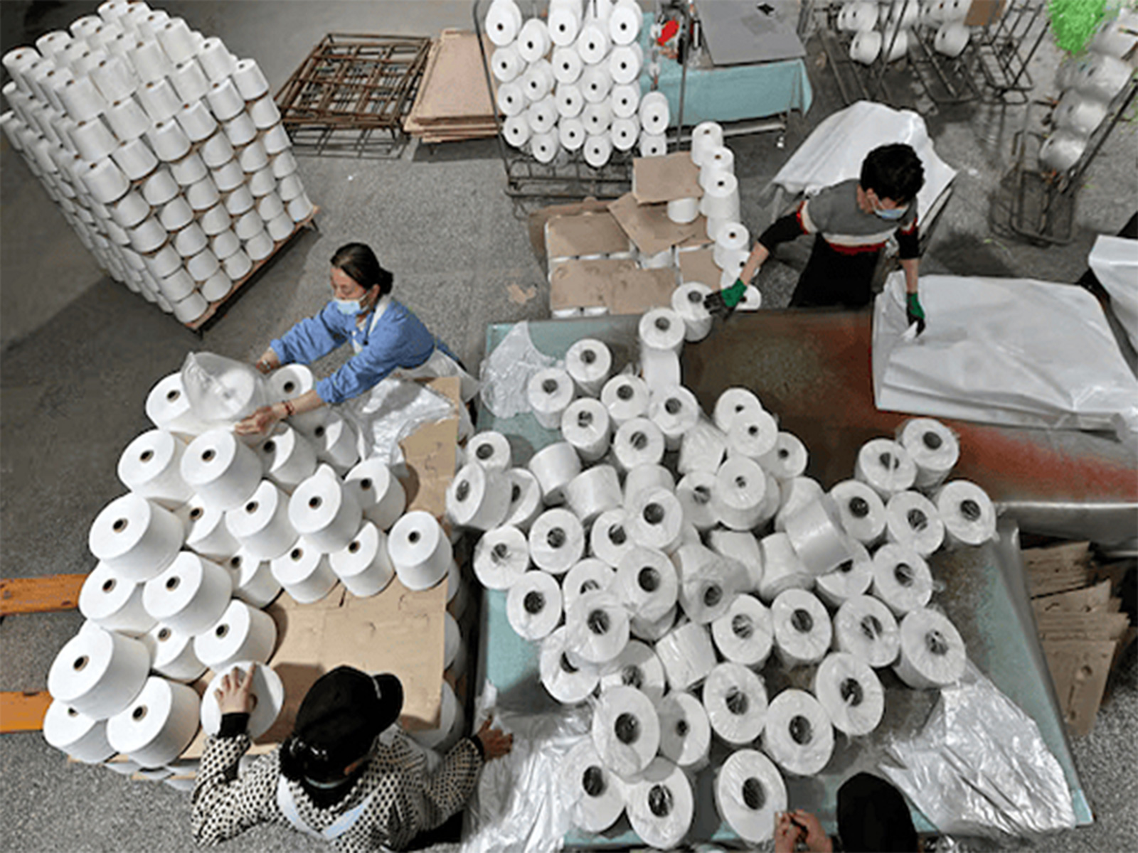 Workers are seen on the production line at a cotton textile factory in China. (Photo/Reuters)