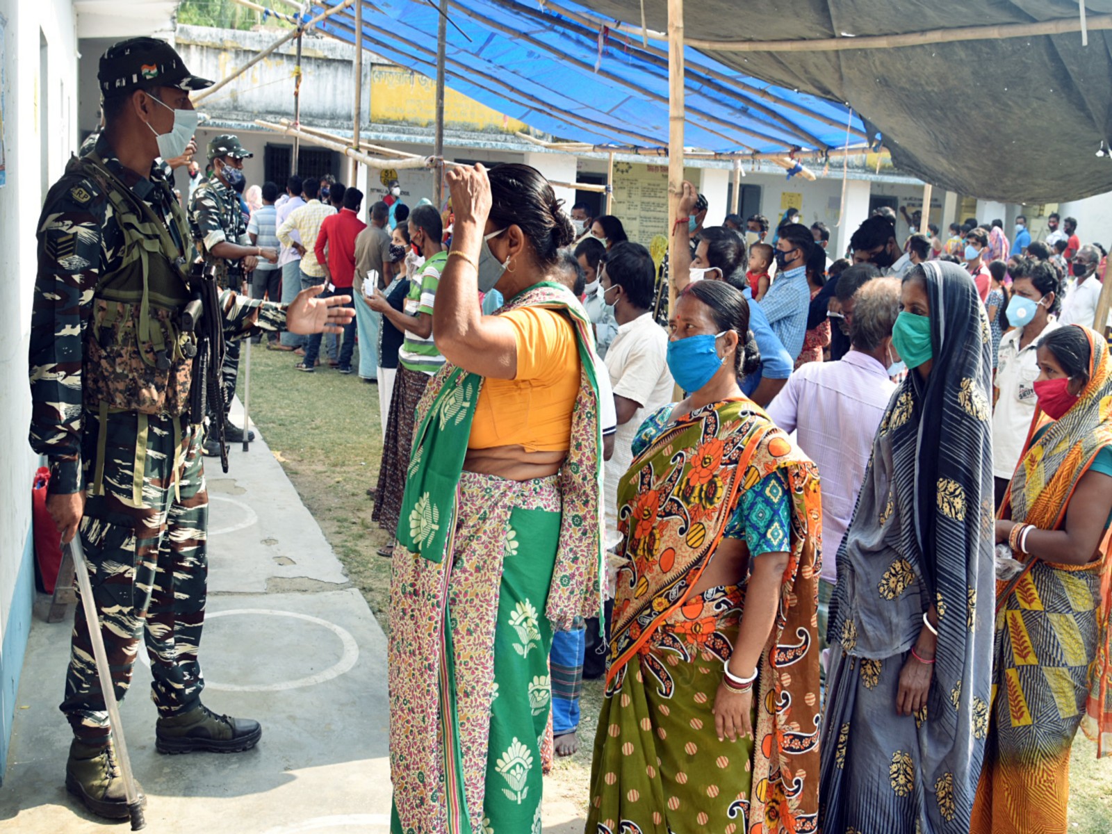 Voters stand in queues at a polling booth to cast vote (File Photo/ANI)