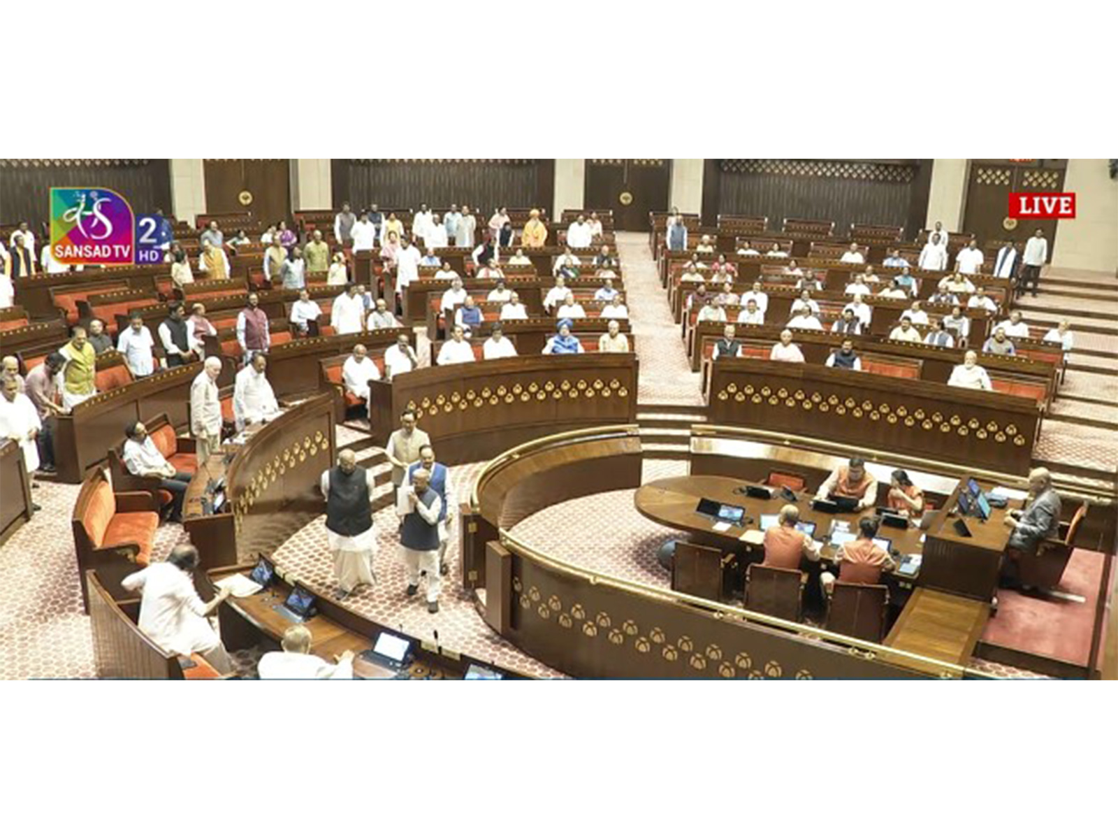 Leader of House JP Nadda and LoP in RS Mallikarjun Kharge walk with Harivansh around the dias (Photo/SansadTV)