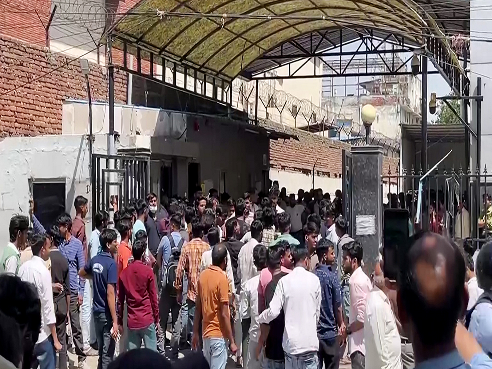 Factory workers protest in Noida Sector 63 (Photo/ANI)