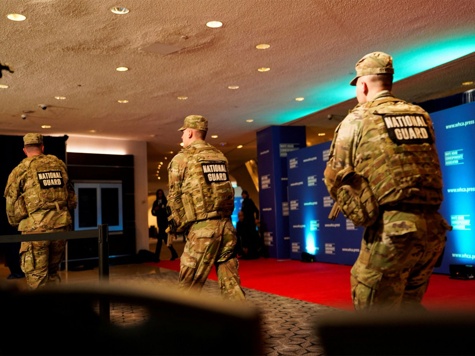 Members of the National Guard rush next to the red carpet of the annual White House Correspondents’ Association dinner after a reported shooting incident in Washington DC (Photo/ Reuters)