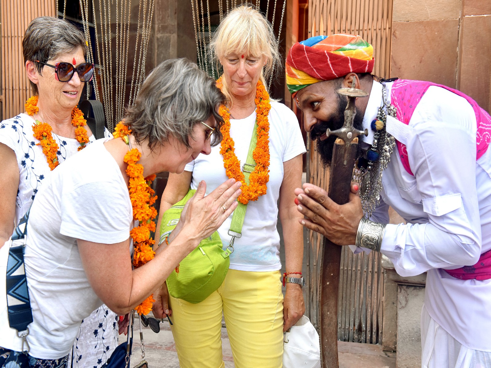 A Rajasthani folk artist welcoming a tourist (Photo-ANI)