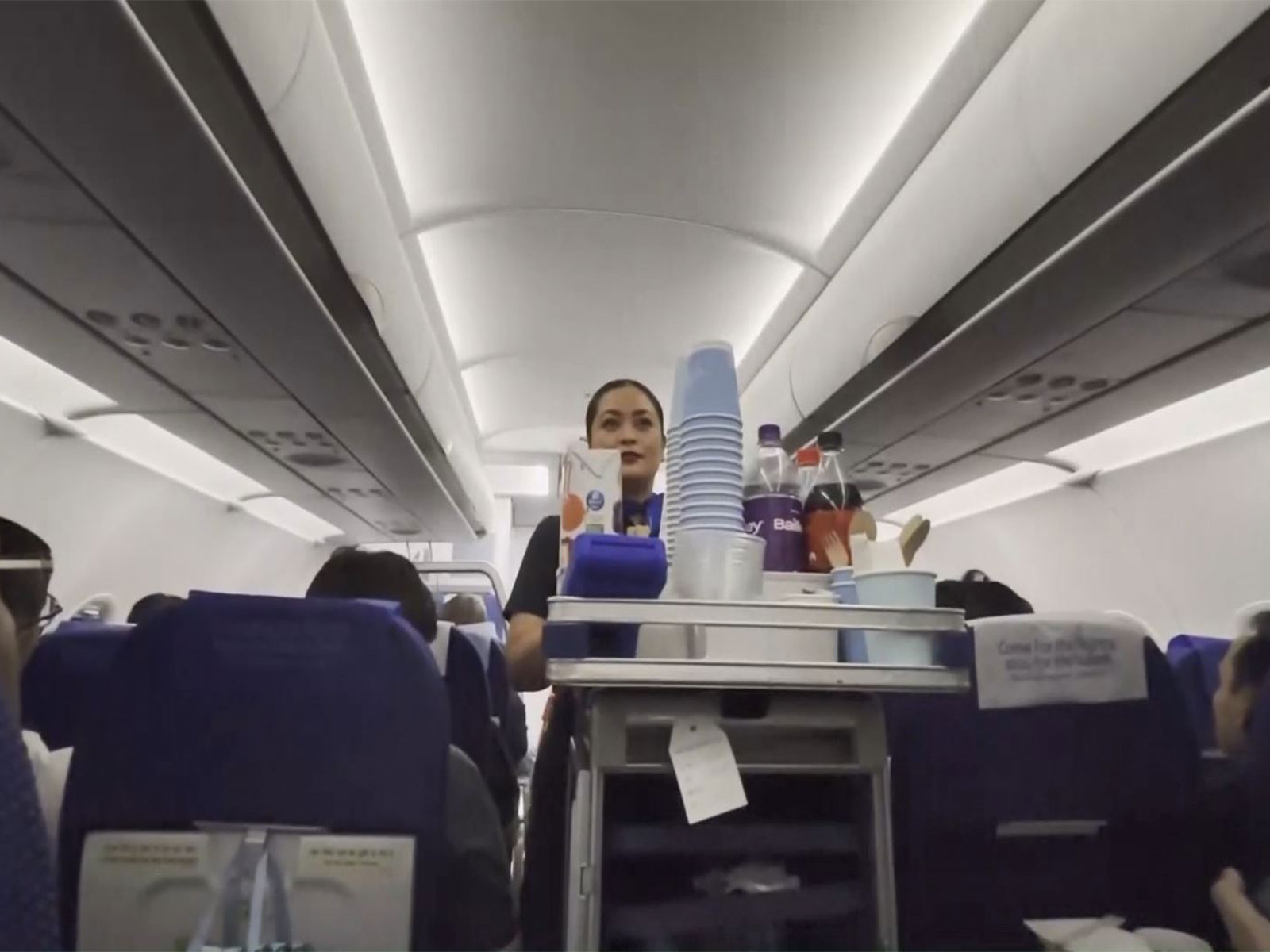 Cabin crew serves refreshments onboard an IndiGo flight on the Delhi–Guangzhou route, marking the resumption of direct air services between India and China. (Photo/ANI)