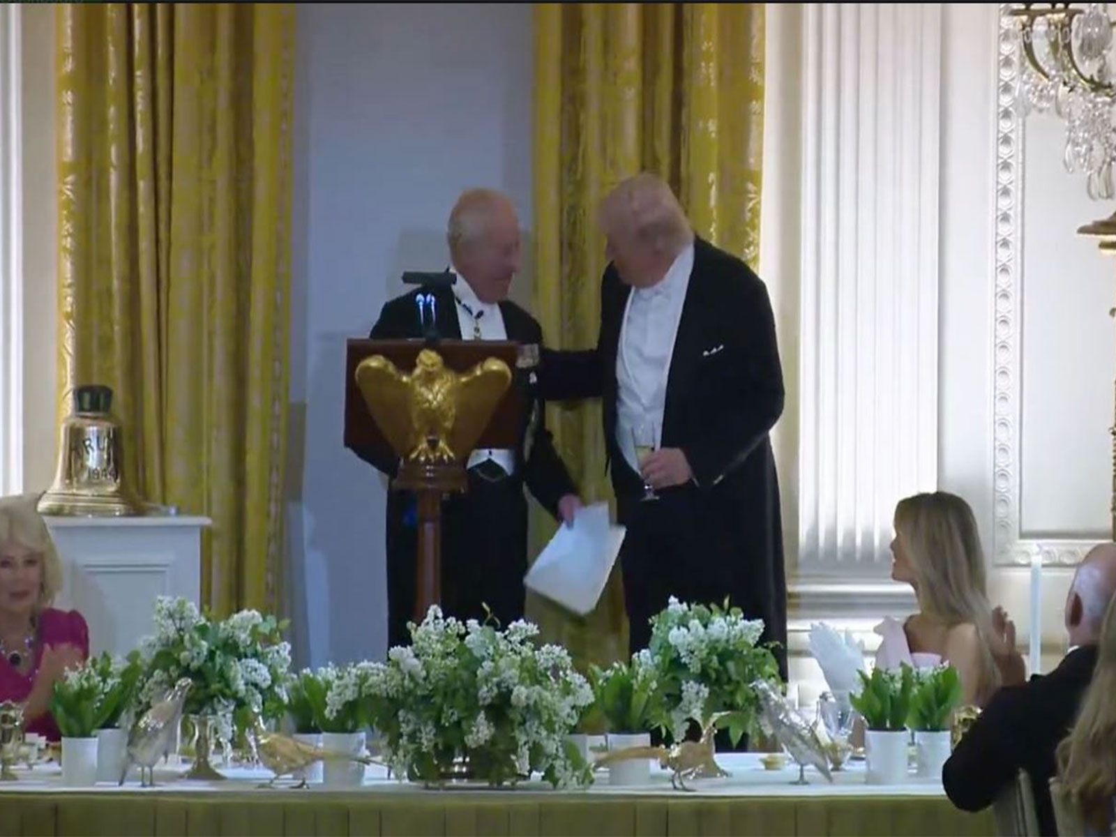 Britain’s King Charles III presents the historic bell from HMS Trump to President Donald Trump during a state dinner at the White House. (Image Source: White House/YouTube)