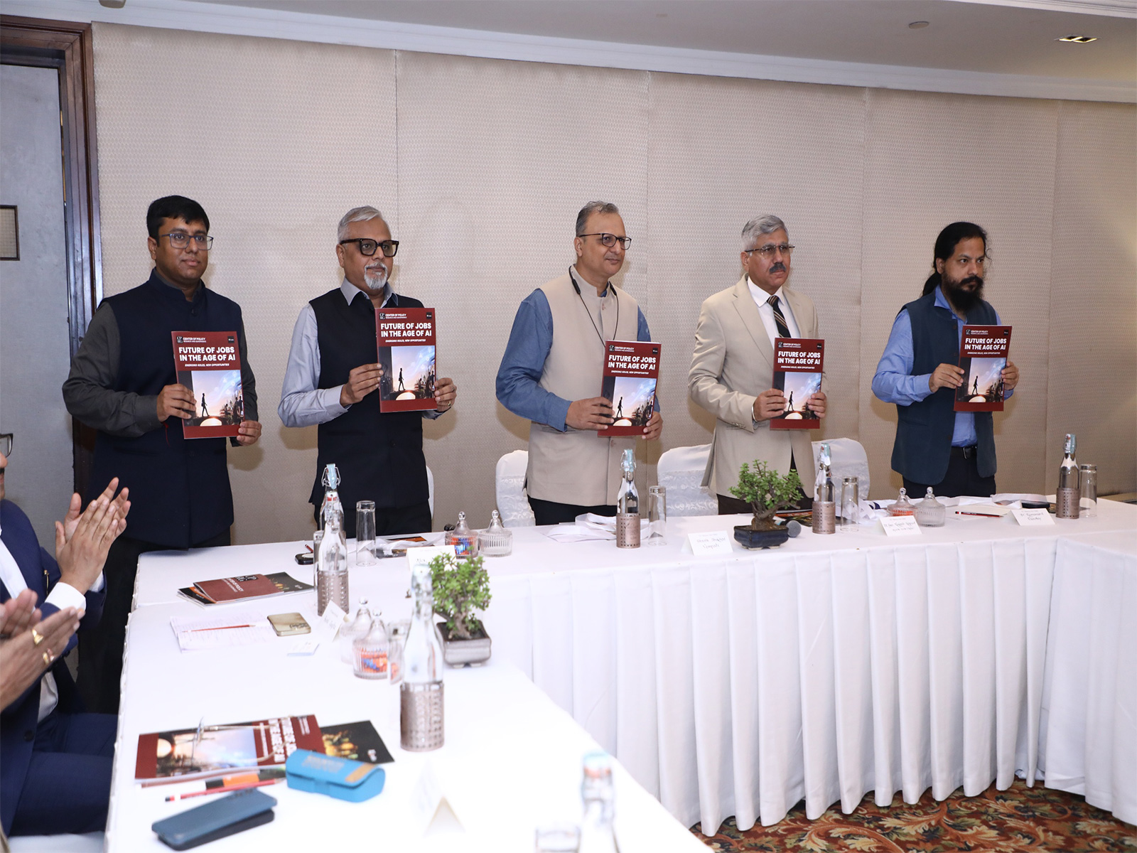 Panel members display the report “Future of Jobs in the Age of AI: Emerging Roles, New Opportunities” at its launch. (Photo/ANI)