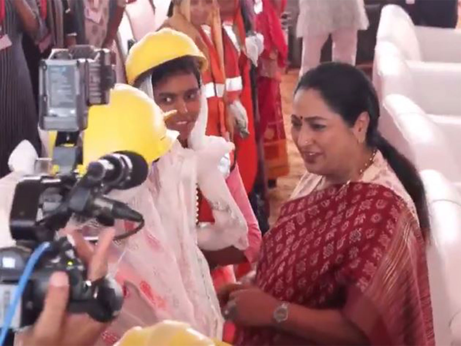 Delhi Chief Minister Rekha Gupta interacting workers (Photo/ANI)