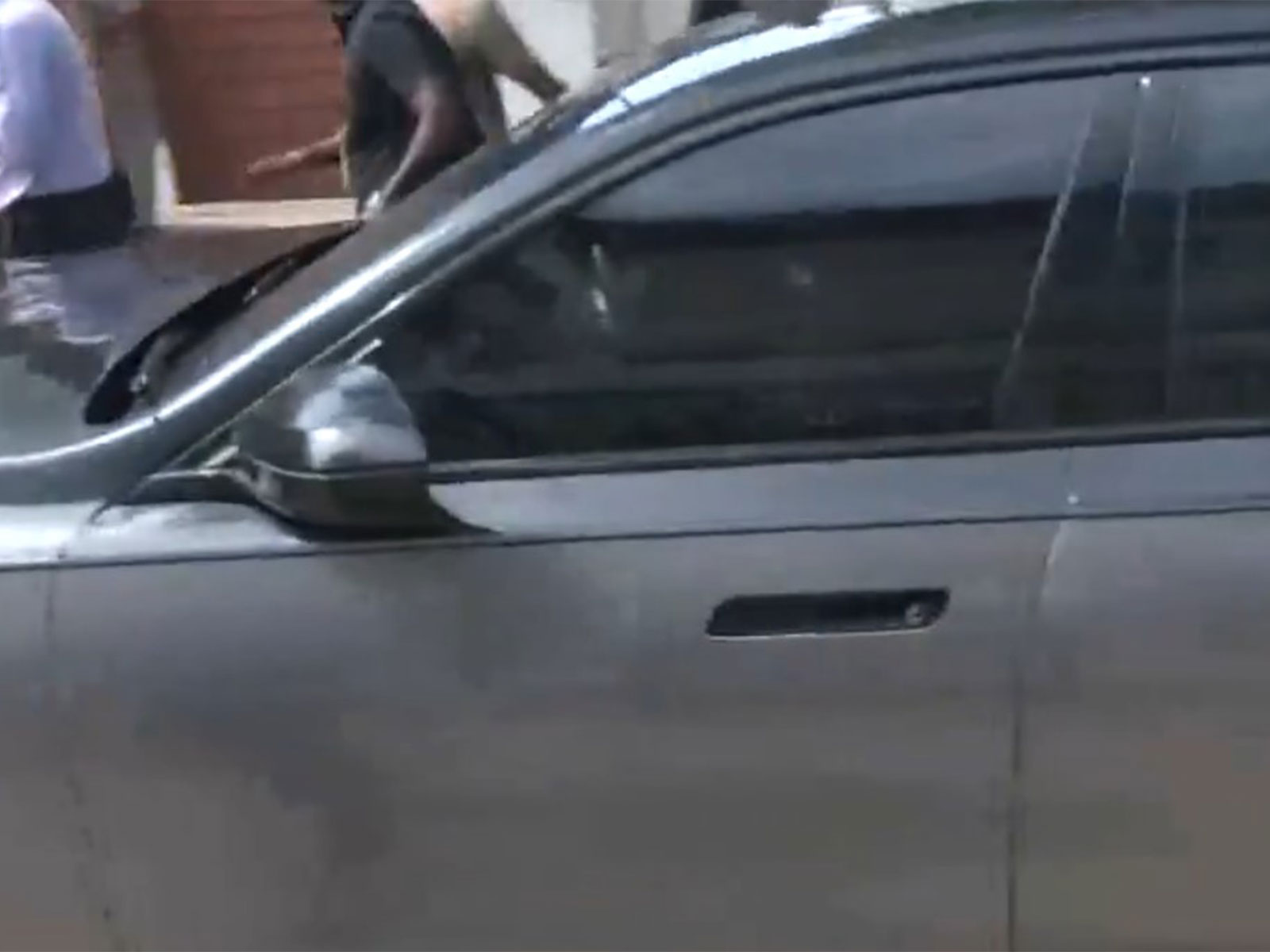 Vijay's car leaving party office (Photo/ANI)