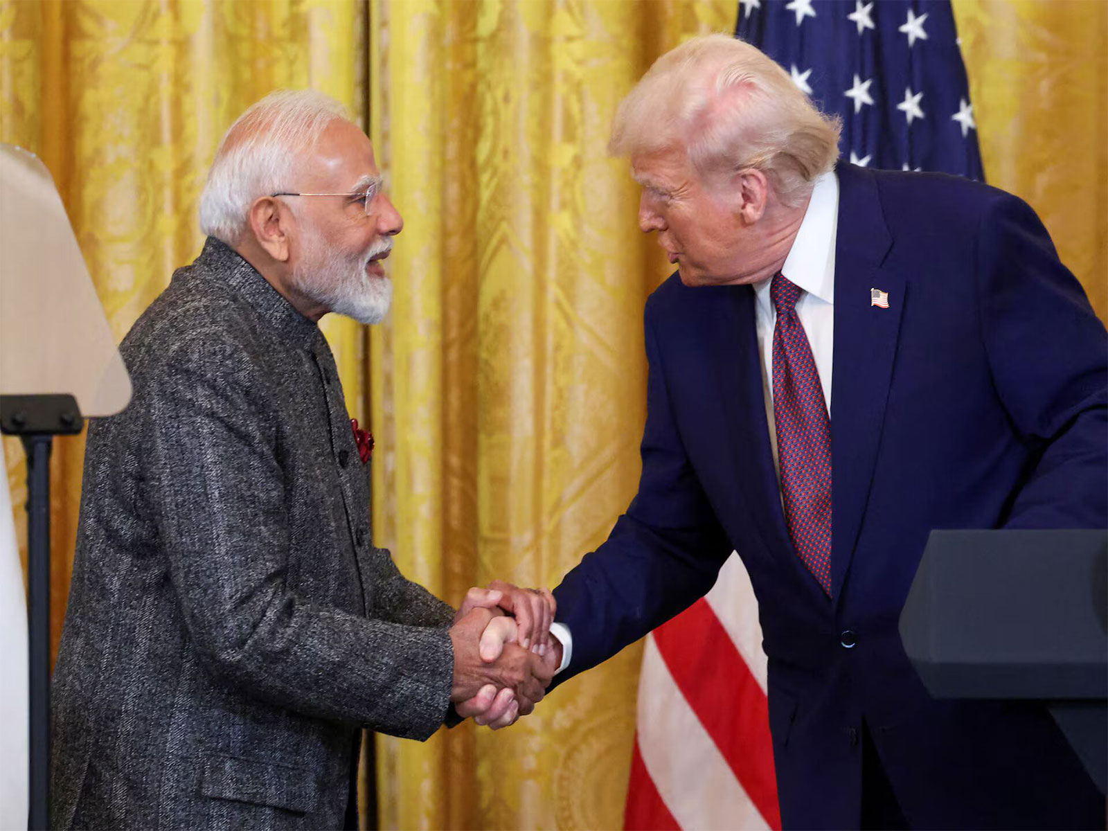 US President Donald Trump and Prime Minister Narendra Modi exchange a handshake during a joint press interaction at the White House in Washington, DC. (File Photo/Reuters)