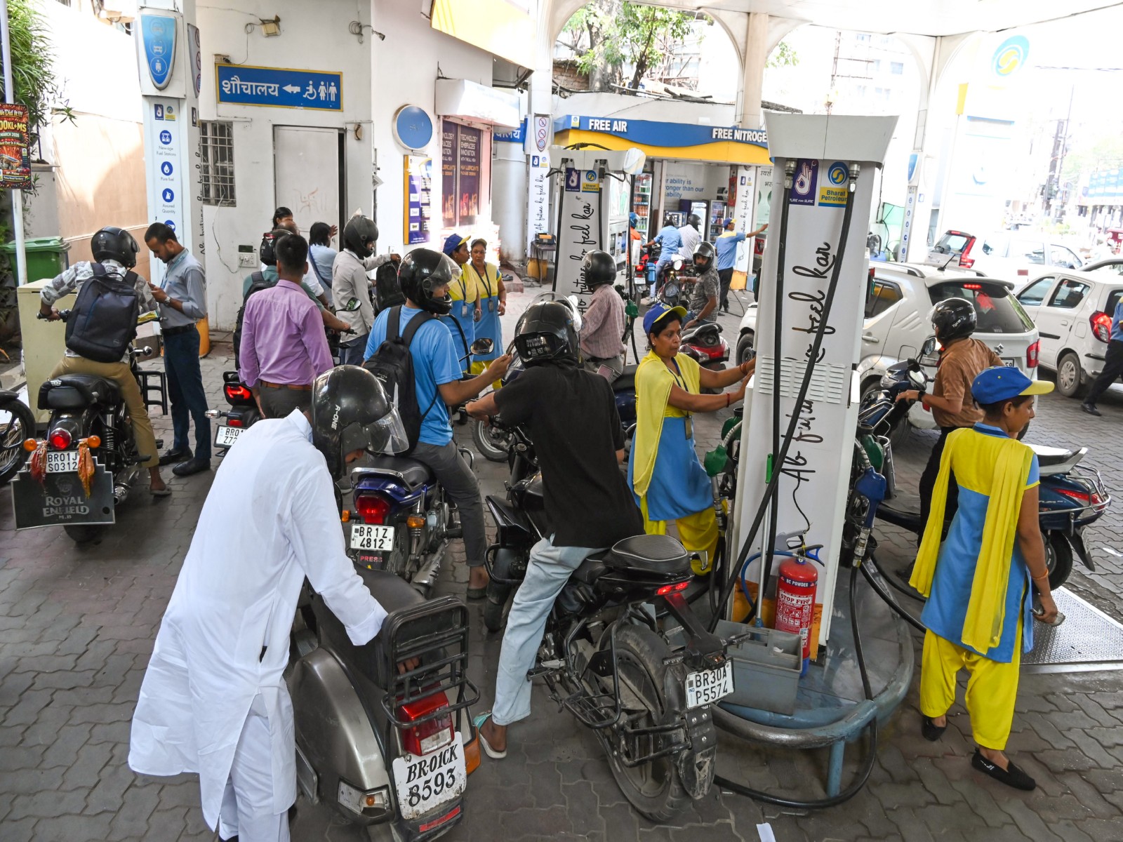 People queue up at a petrol pump for fuel due to a shortage of fuel (Photo/ANI)
