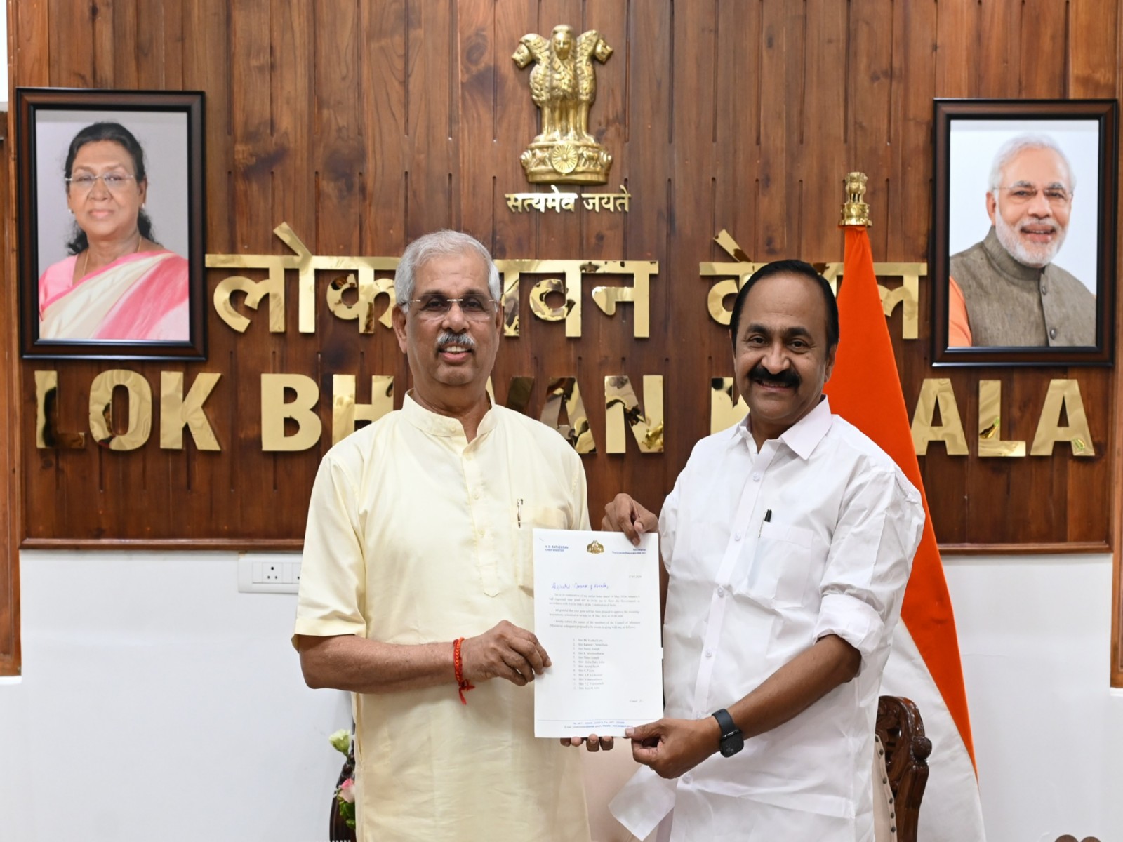 VD Satheesan (left) hands over list of Ministers to be sworn in on May 18 along with him to Governor Shri Rajendra Vishwanath Arlekar at Lok Bhavan in Thiruvananthapuram. (Photo/ANI)