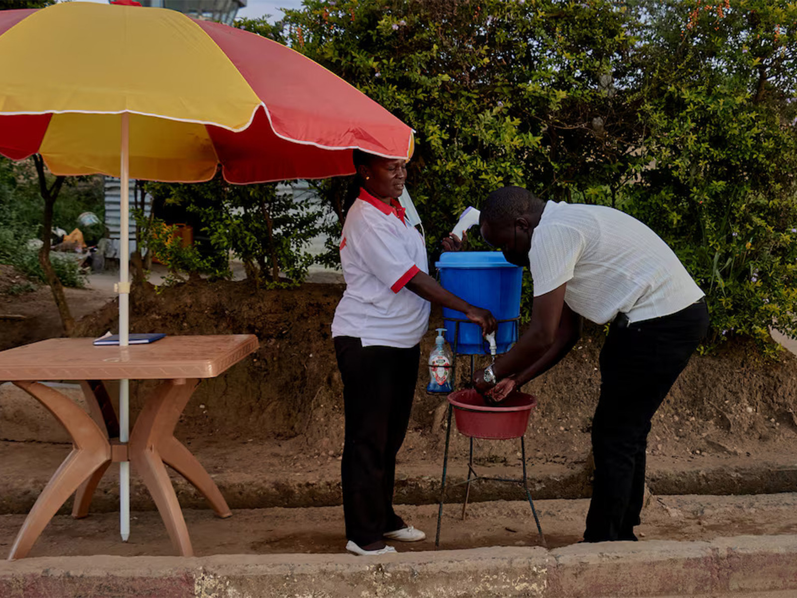 A man washes his hands near Bunia National Airport in Bunia, Ituri province, Democratic Republic of Congo, as aid agencies intensify containment efforts following a new Ebola outbreak involving the Bundibugyo strain. (Photo/Reuters)