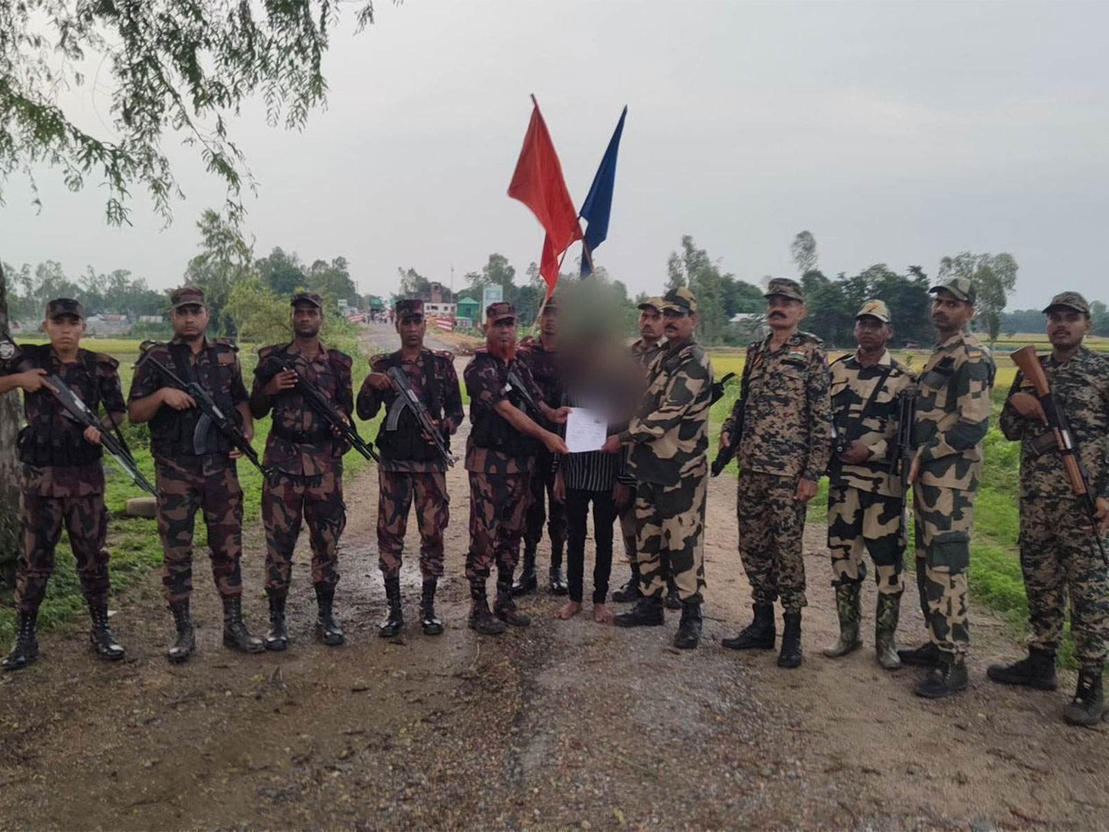 Visual of security forces along with deported Bangladeshi national (Photo/@himantabiswa/X)