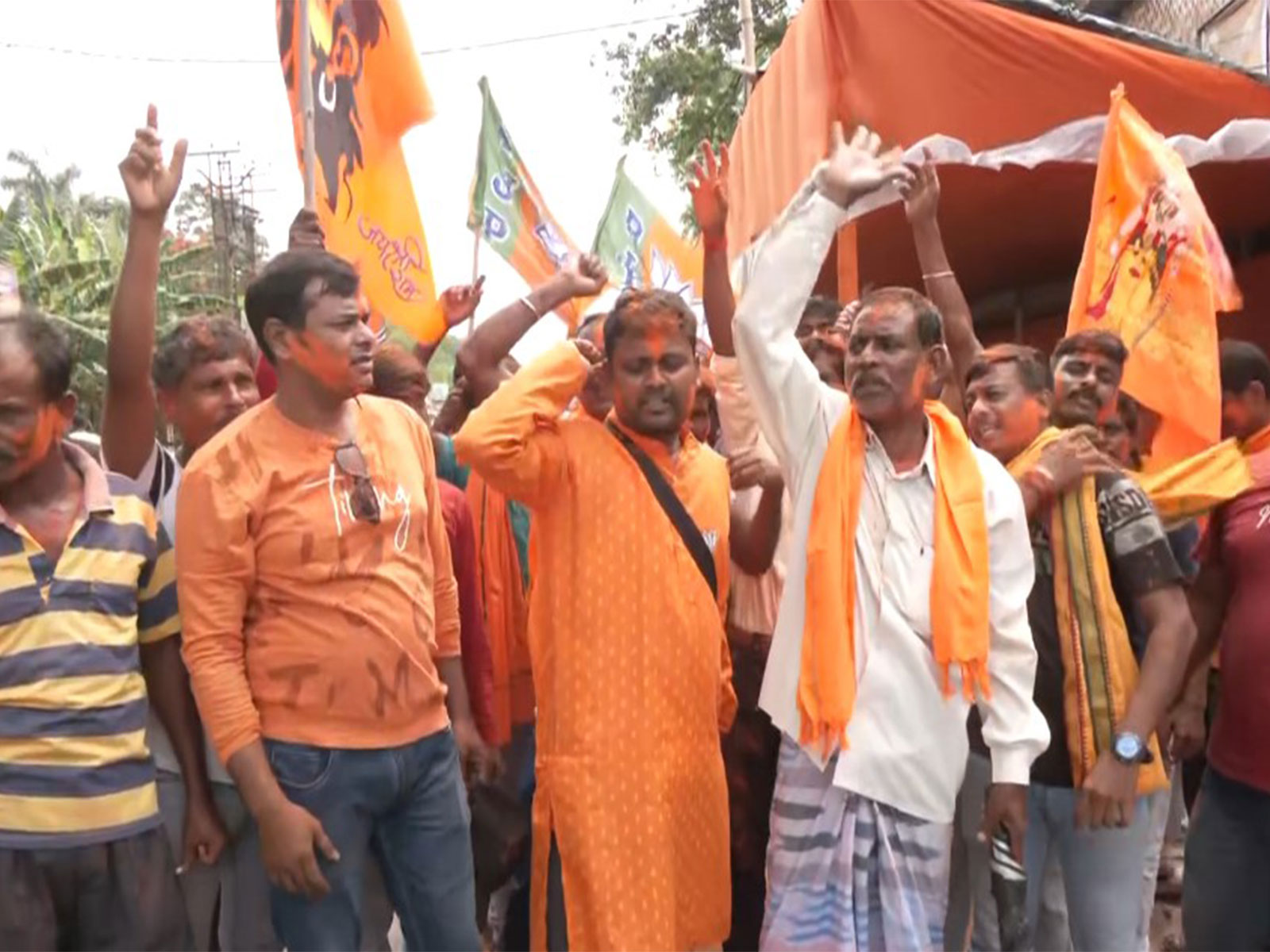 BJP workers celebrating with colours, distributing sweets (Photo/ANI)