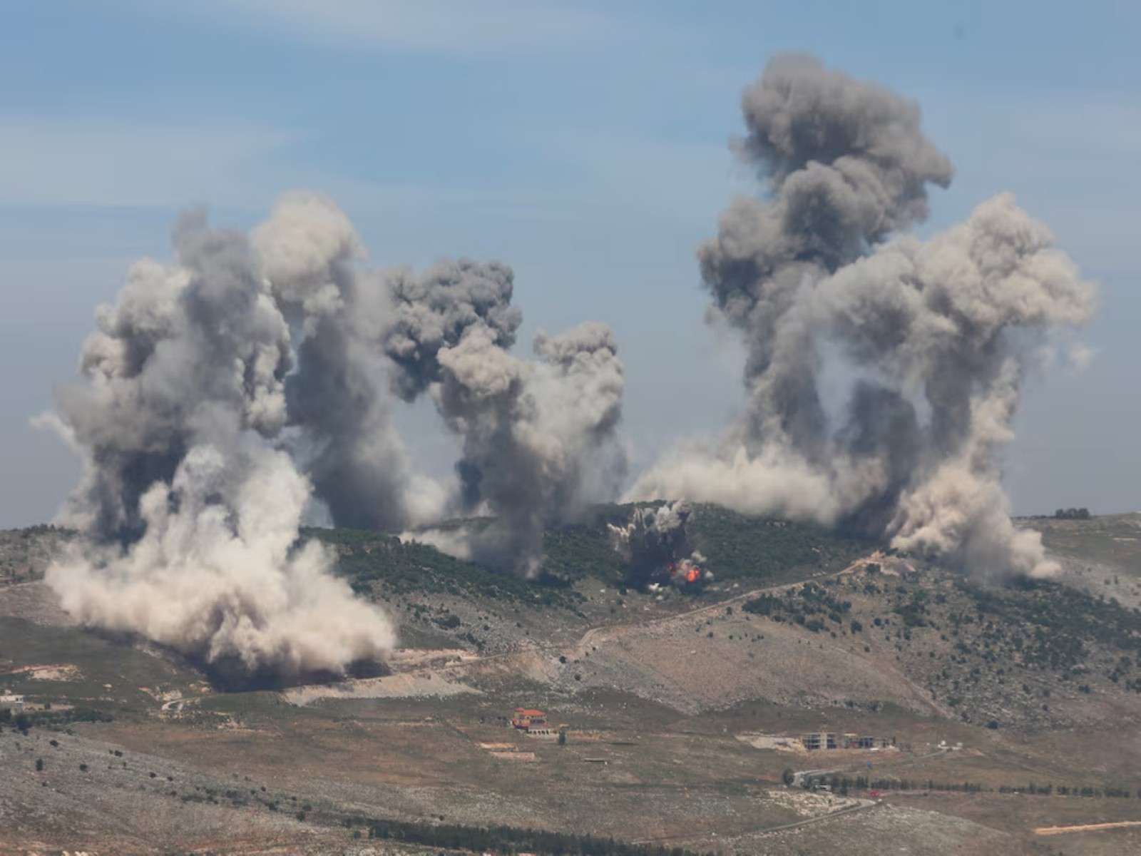 Smoke billows over southern Lebanon as Israeli air strikes pound the Nabatieh district. (Photo/Reuters) Smoke billows over southern Lebanon as Israeli air strikes pound the Nabatieh district. (Photo/Reuters)