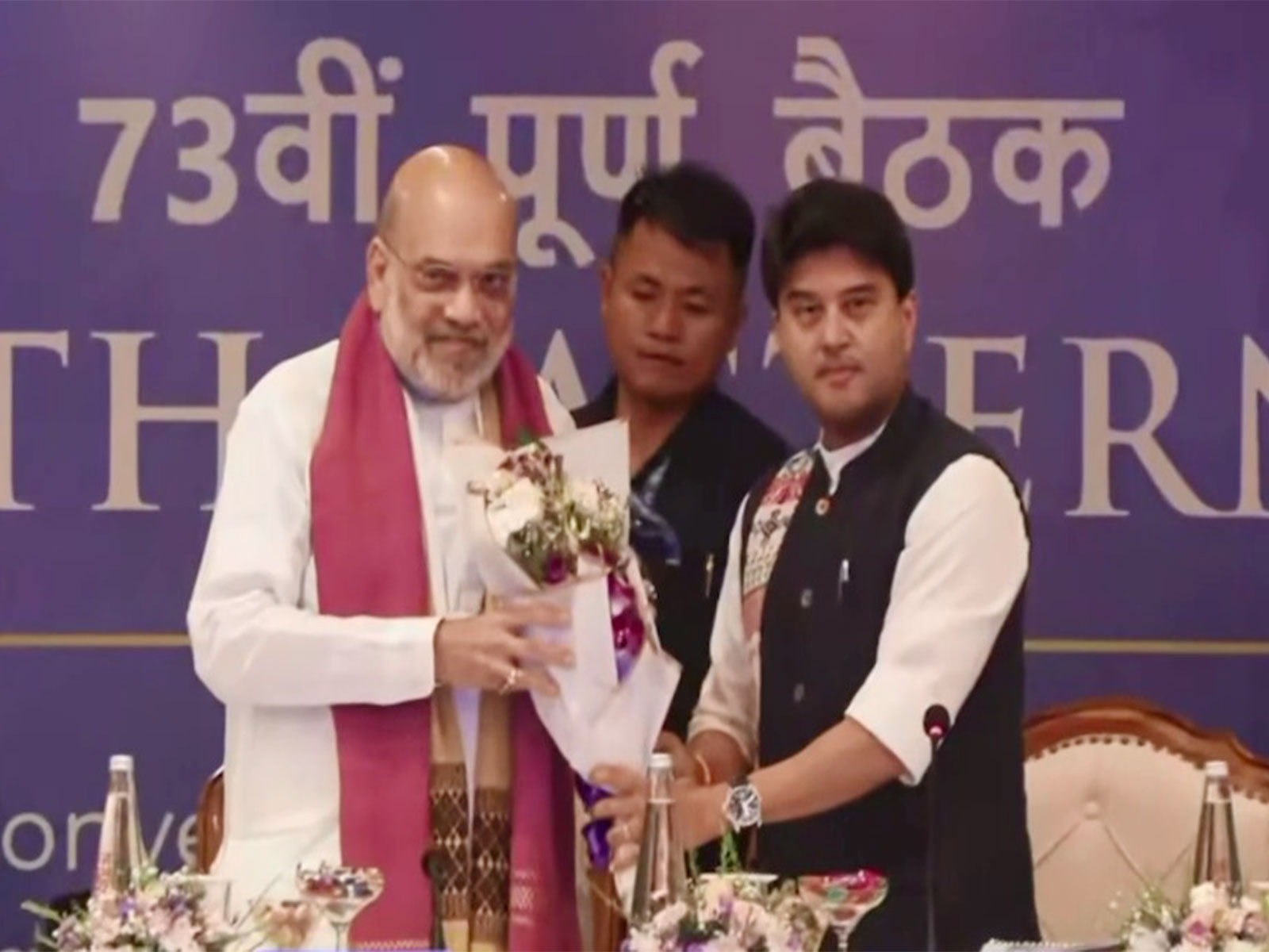 Amit Shah being felicitated by Jyotiraditya Scindia during NEC meeting (Photo/ANI)
