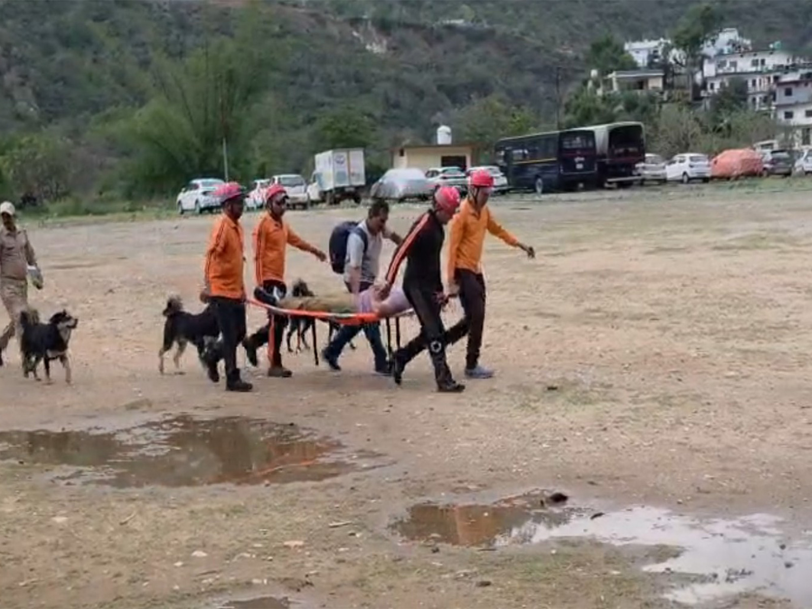 Medical team lifts injured pilgrim for emergency treatment (Photo/ANI)