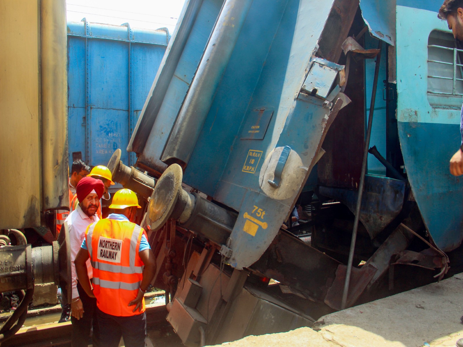 Railway workers inspect the damaged coach of a Katra-bound special train at Ludhiana (File Photo/ANI)