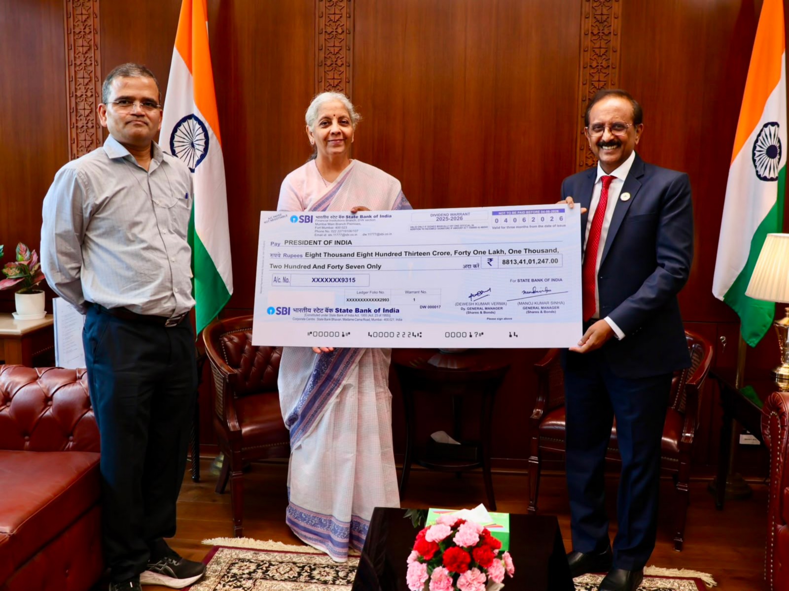 SBI hands over Rs 8,813 cr dividend cheque to govt for FY26 (Photo-Ministry of Finance) SBI hands over Rs 8,813 cr dividend cheque to govt for FY26 (Photo-Ministry of Finance)