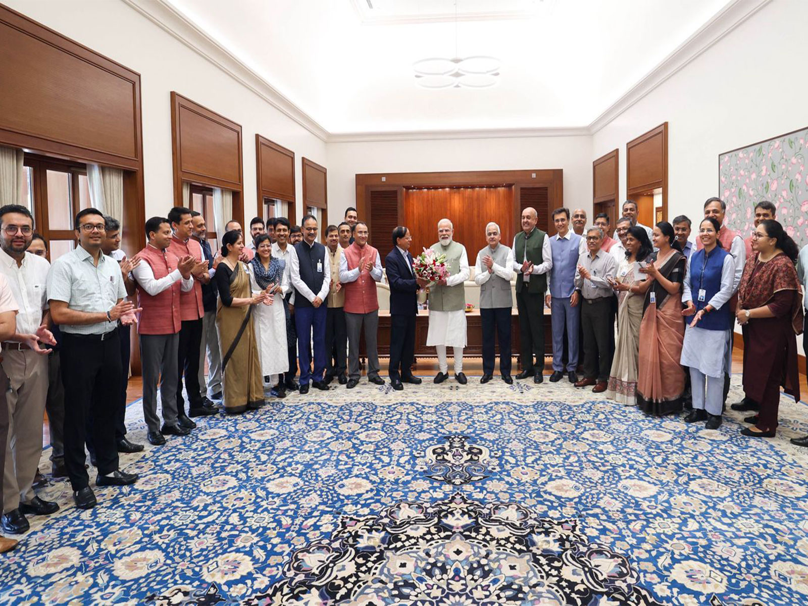 PMO officers with PM Modi (Photo/x/@PMOIndia)