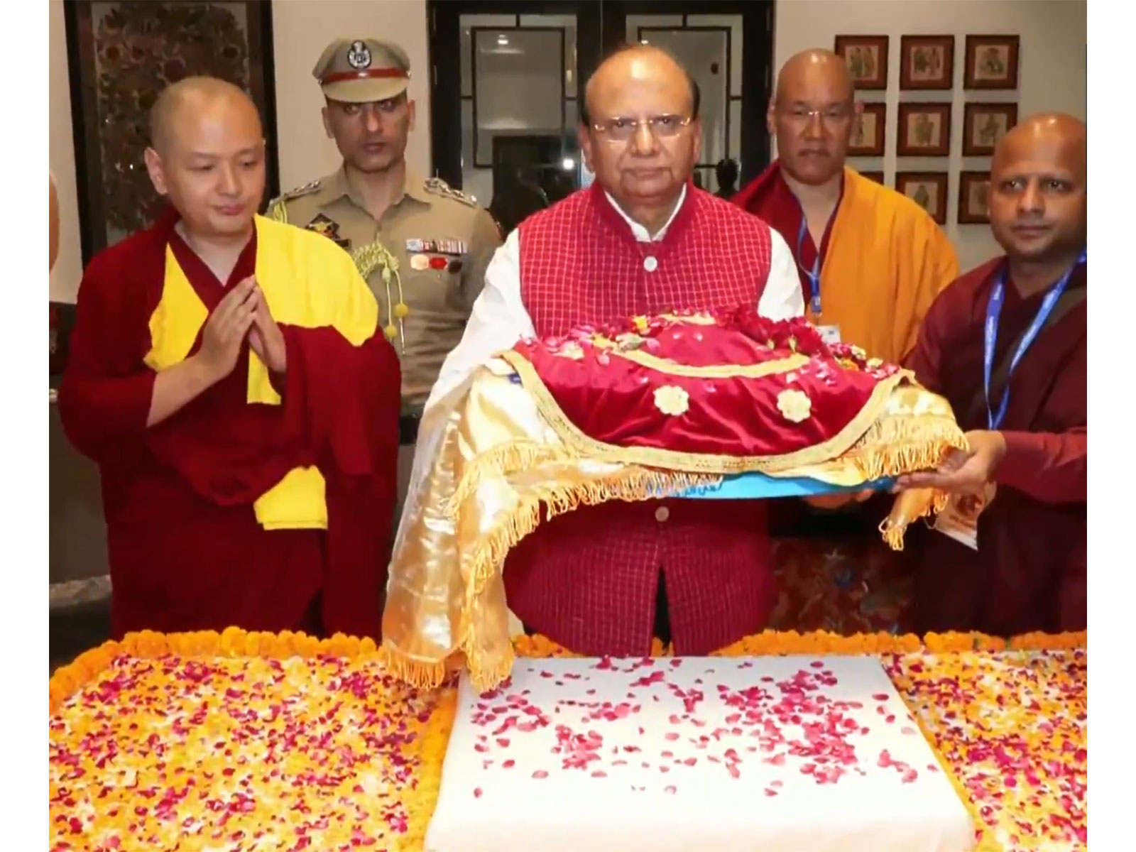 Lieutenant Governor of Ladakh Vinai Kumar Saxena carrying the holy relics (Photo/ANI)