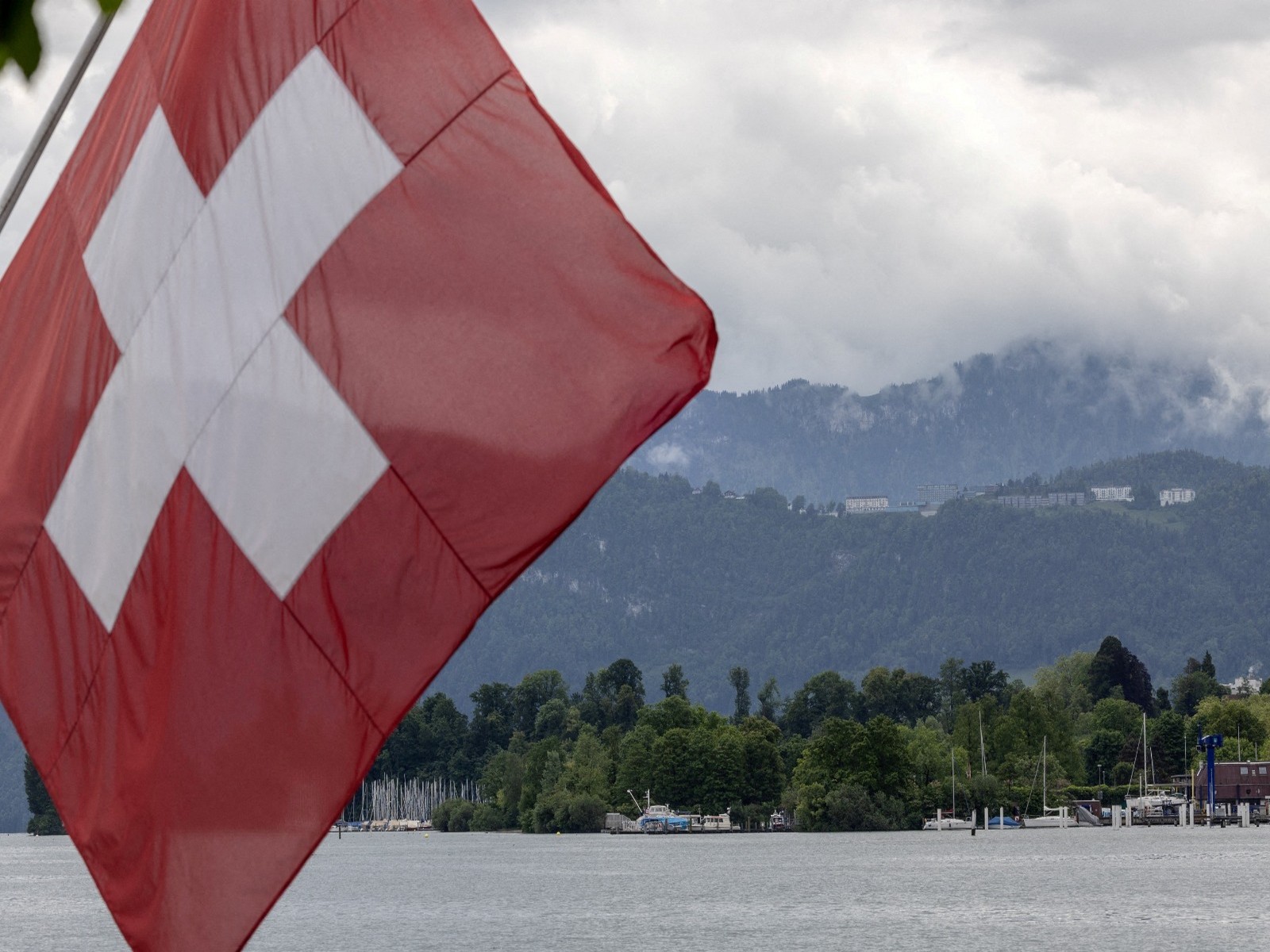 A Swiss flag is pictured in front of the Burgenstock Resort in Lucerne, Switzerland (File Photo/Reuters)