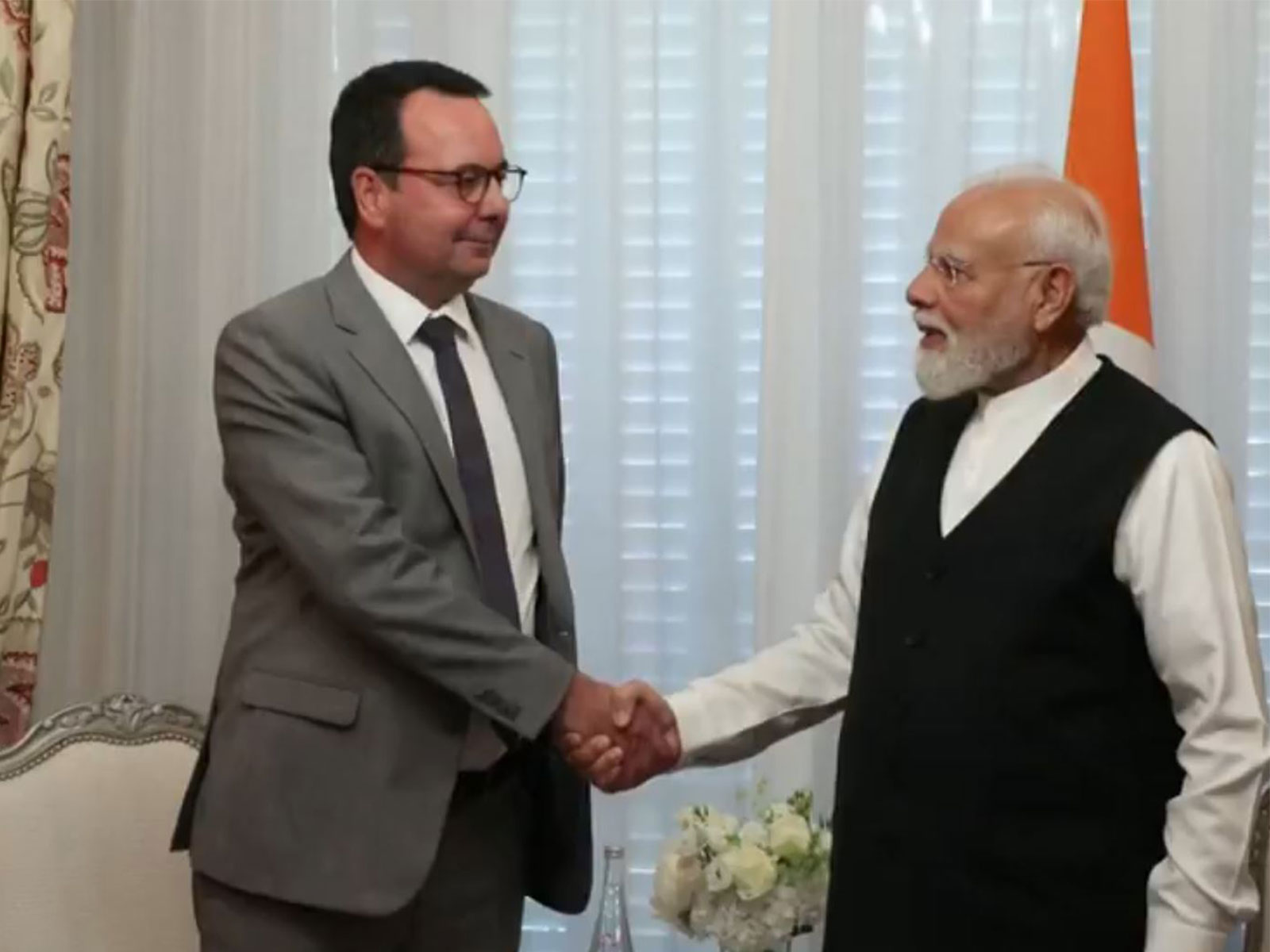 Prime Minister Narendra Modi meets Alstom CEO Martin Sion during his visit to Paris, France. (Photo/ANI)