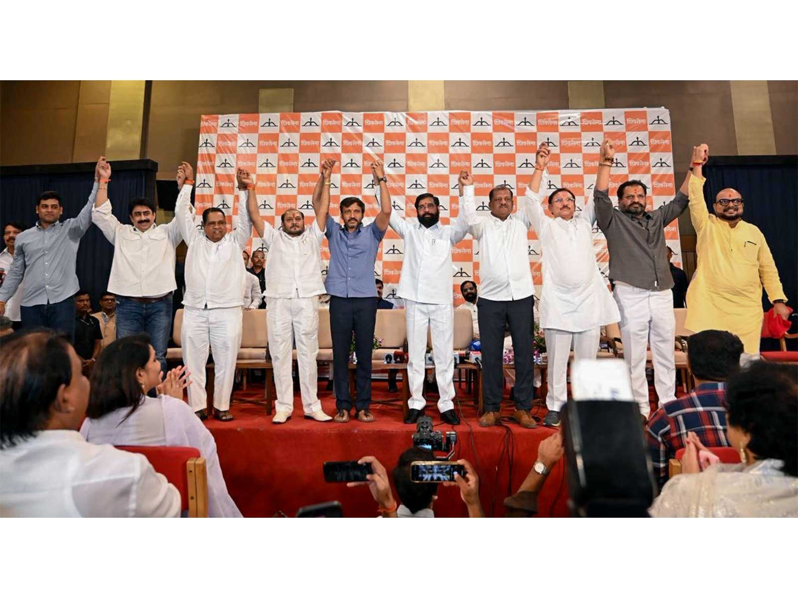 Maharashtra Dy CM Eknath Shinde with six UBT MPs who joined Shiv Sena (Photo/ANI)