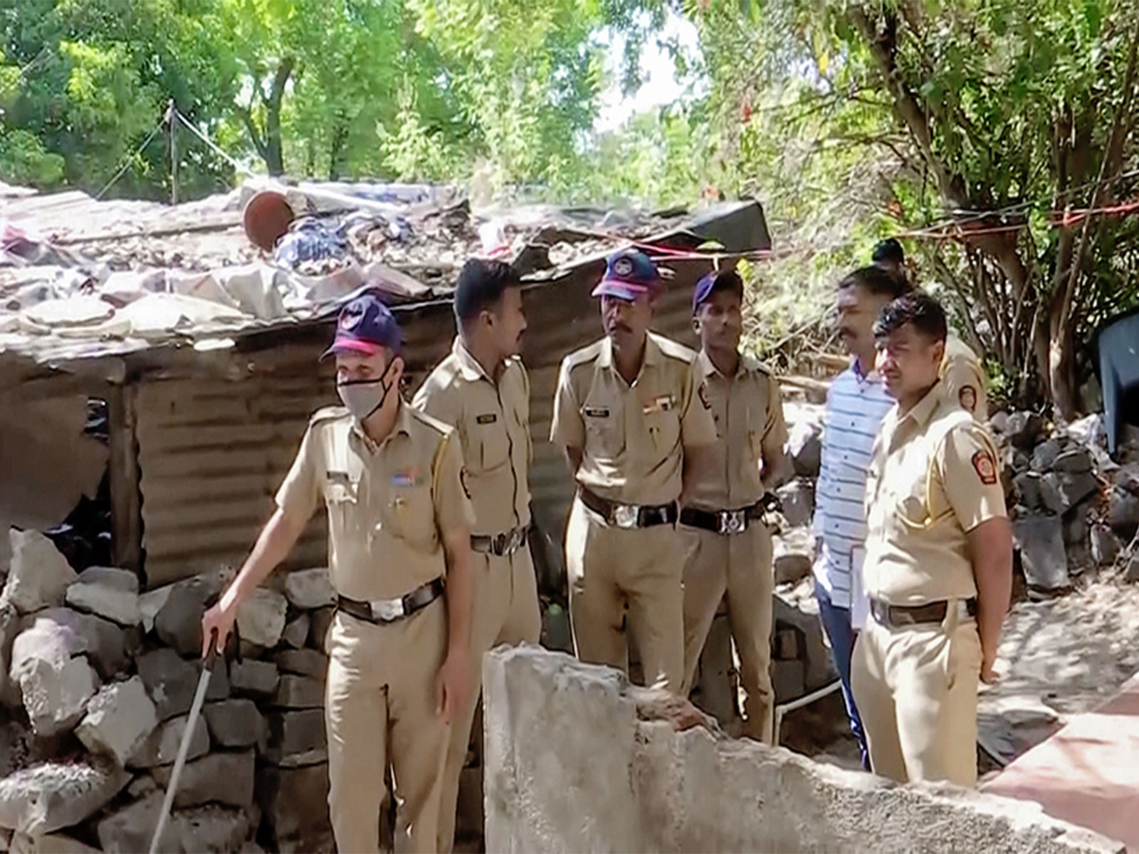 Police at the spot where a 4-year-old girl was allegedly sexually assaulted and murdered by a 65-year-old man in a village in Pune (File Photo/ANI)