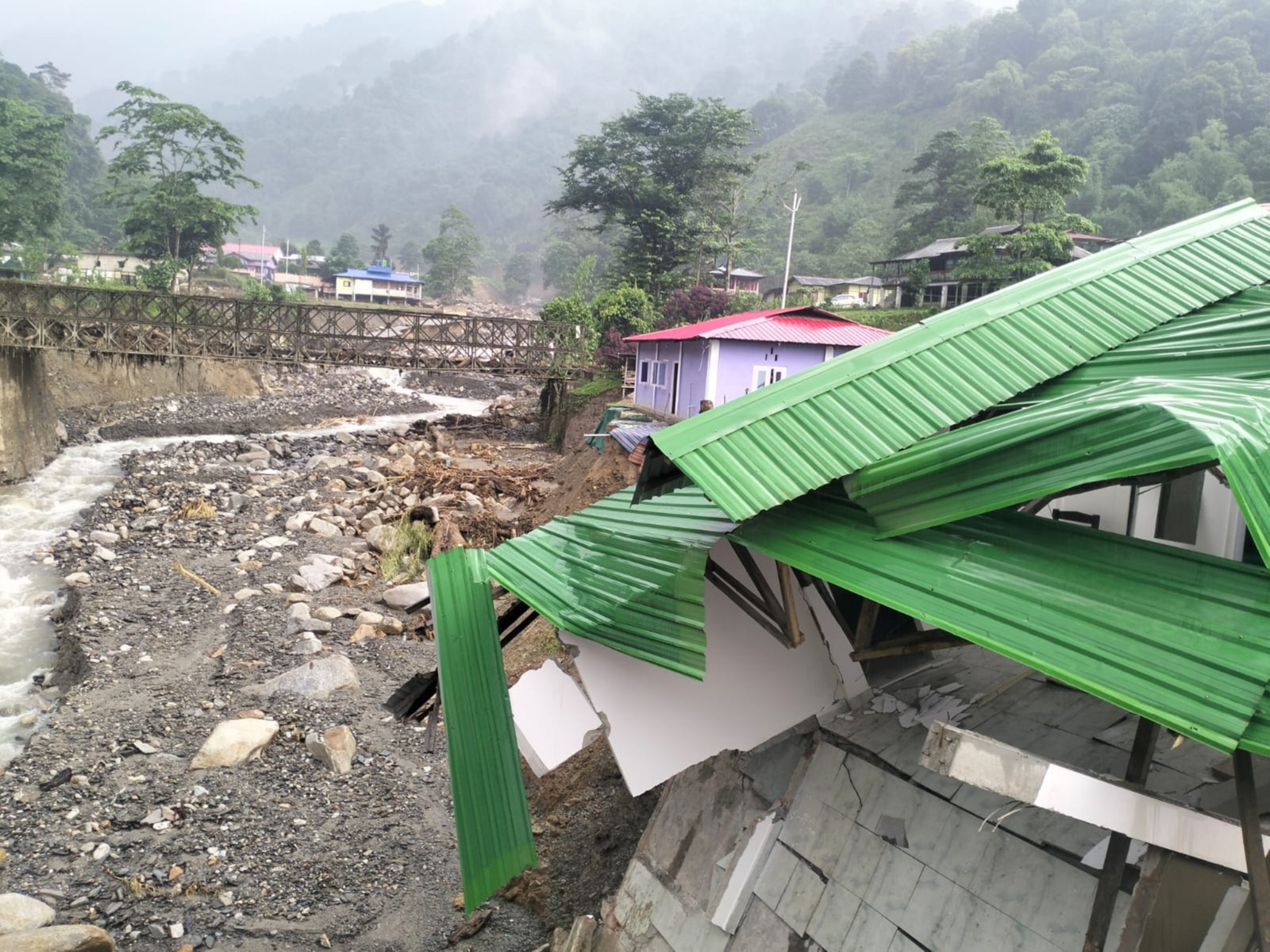 A view of a damaged house following incessant heavy rainfall which triggered a flash flood in Arunachal Pradesh (Photo/ANI)