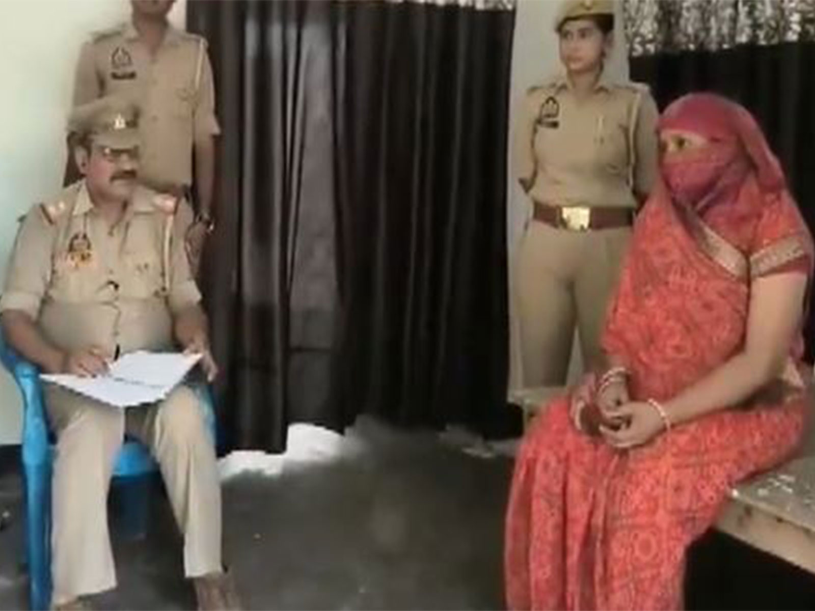 Sushma Mishra, relative of accused Anukalp Mishra and Police officials (Photo/ANI)