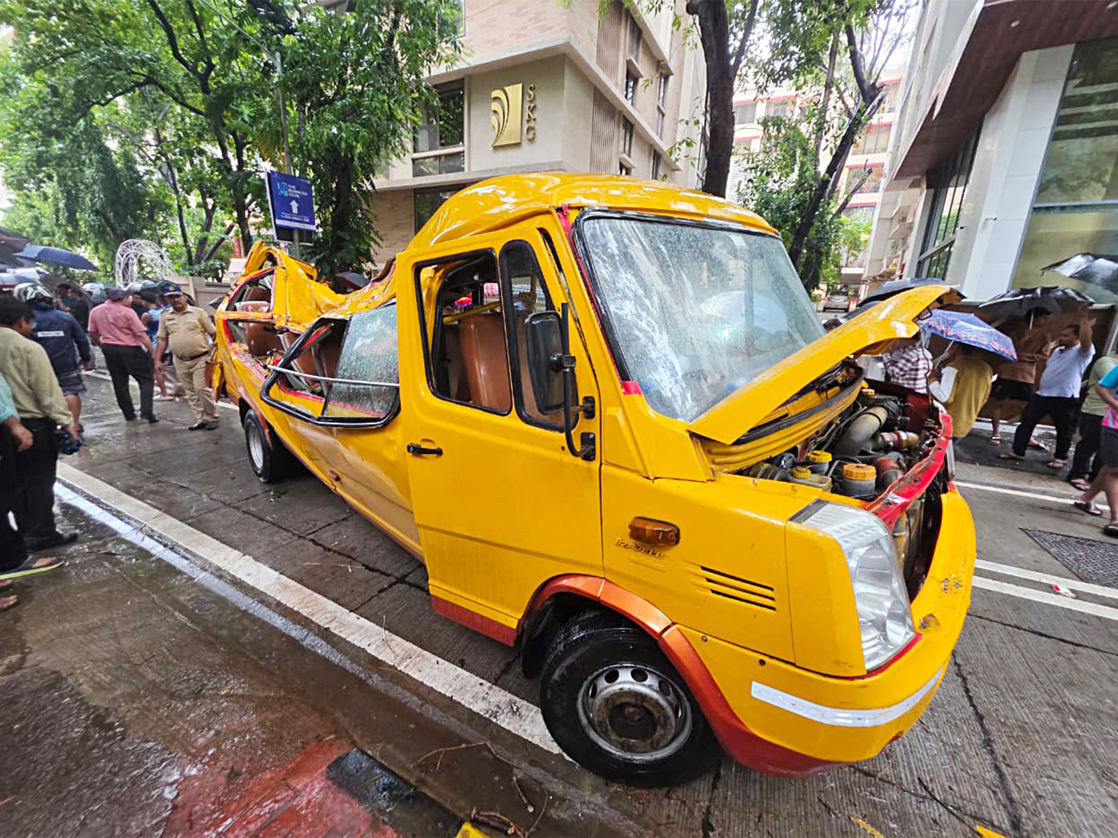 A view of the damaged school bus after a tree collapsed over it at Chembur, in Mumbai (Photo/ANI) A view of the damaged school bus after a tree collapsed over it at Chembur, in Mumbai (Photo/ANI)
