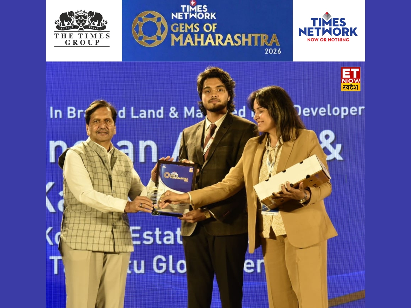 Kanchan Aswani and Kartik Shivnani of Konkan Estates receive an award from Maharashtra Minister Shri Mangal Prabhat Lodha at the Gems of Maharashtra event in Mumbai.