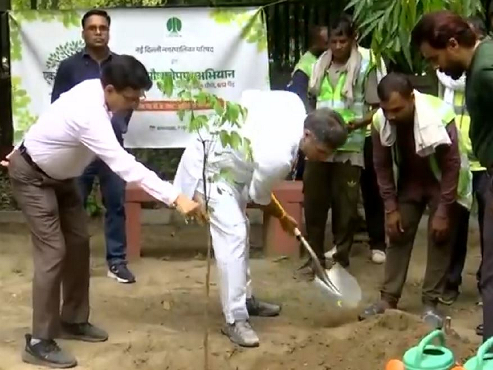 Visuals of Delhi Minister Parvesh Sahib Singh participating in a tree plantation drive at Children's Park near India Gate. (Photo: ANI)
