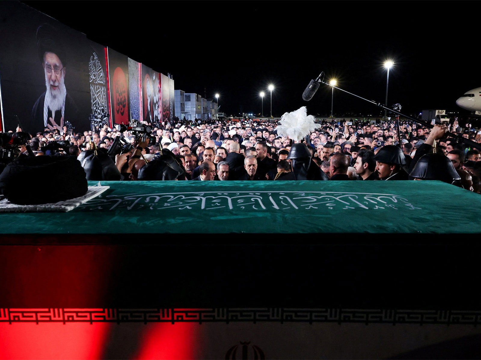 Iranian President Masoud Pezeshkian stands amid mourners gathered around the casket of Iran’s late Supreme Leader Ayatollah Ali Khamenei, who was killed on February 28 during Israeli and U.S. airstrikes on Iran, after its arrival at Najaf International Airport in Najaf, Iraq (Photo/Reuters)