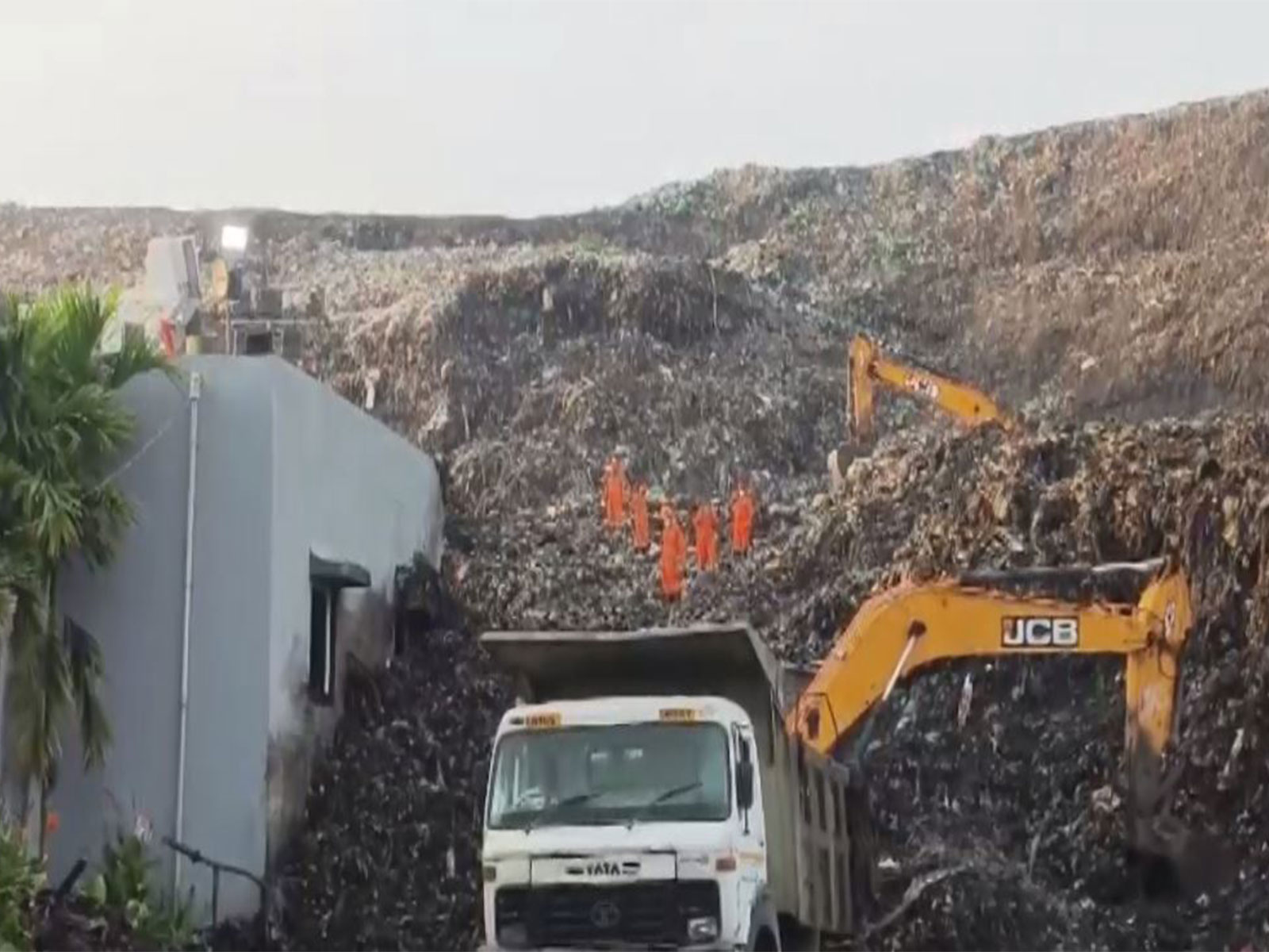 Earth movers deployed at building collapse site at Moshi (Photo/ANI)