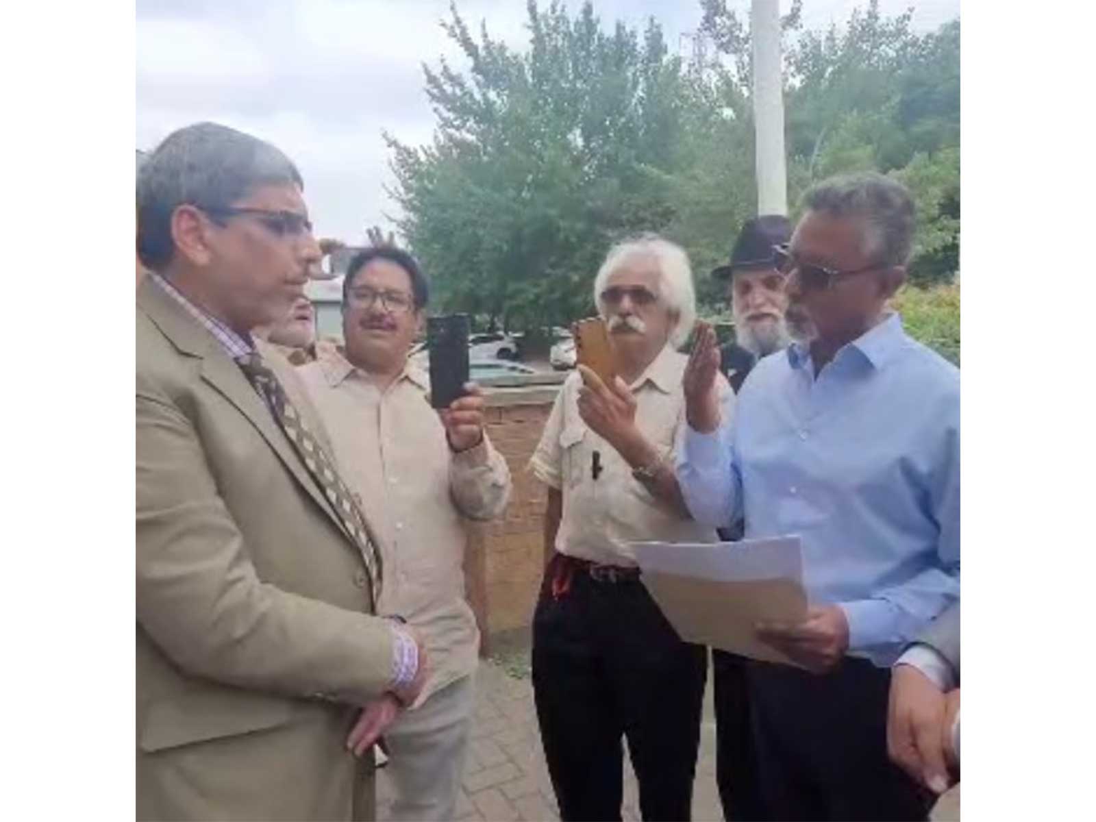 PoJK activists submitting memorandum to official of Pakistani consulate in Bradford after the protest (Photo/ANI)