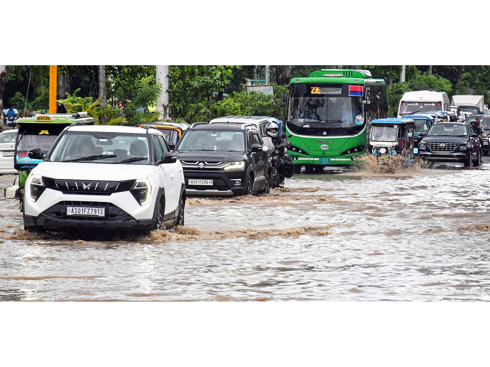 Vehicles wade through a waterlogged road after heavy rainfall in Guwahati (File Photo/ANI) Vehicles wade through a waterlogged road after heavy rainfall in Guwahati (File Photo/ANI)