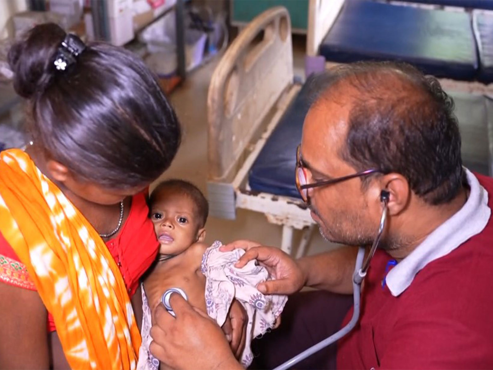 Visual of a doctor treating an infant in Sukma (Photo/ANI) Visual of a doctor treating an infant in Sukma (Photo/ANI)