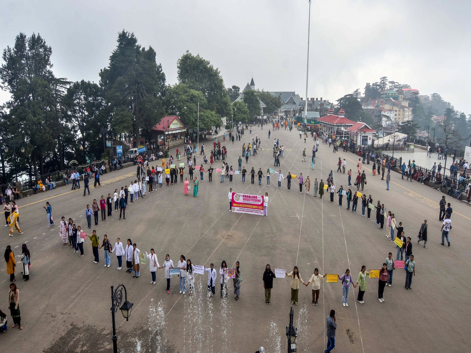 Students make a human chain during awareness rally on World Breastfeeding Day, at Ridge in Shimla in 2023. (Photo/ANI)
